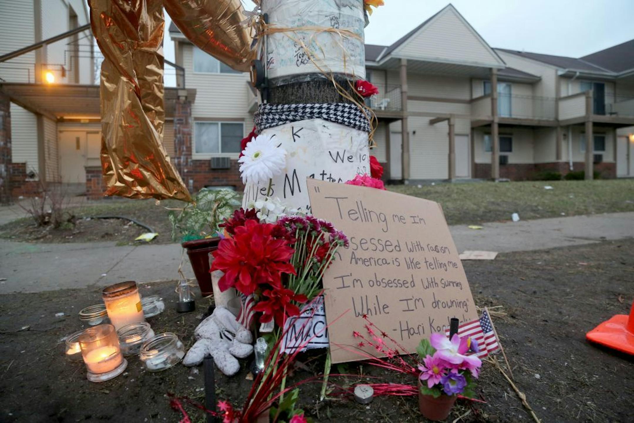 A day after Hennepin County DA Mike Freeman decided not to charge two police officers in the shooting of Jamar Clark in November, candles at a memorial site for Clark still burn at dawn Thursday, March 31, 2016, in Minneapolis, MN.