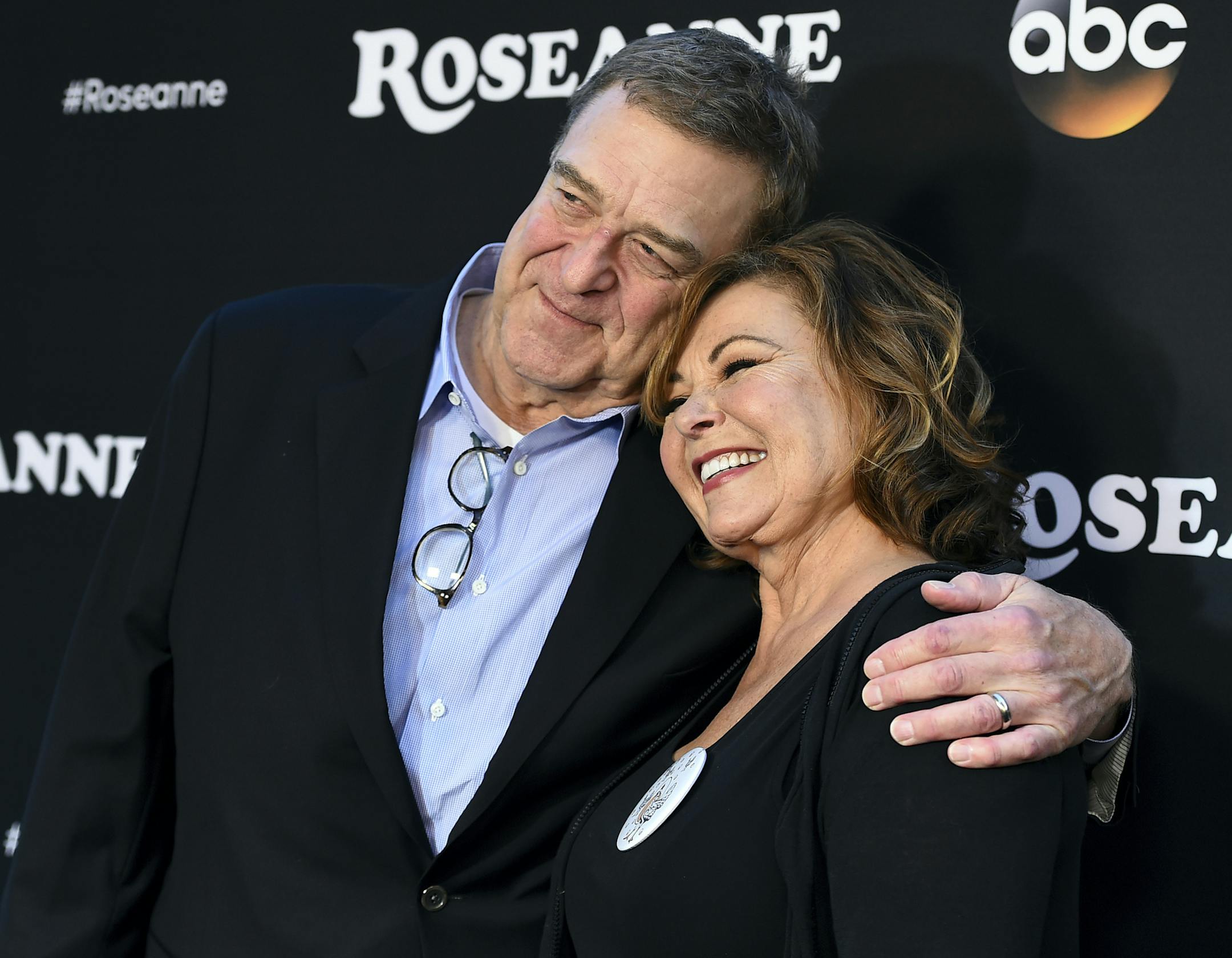 John Goodman, left, and Roseanne Barr arrive at the Los Angeles premiere of "Roseanne" on Friday, March 23, 2018, in Burbank, Calif. (Photo by Jordan Strauss/Invision/AP)