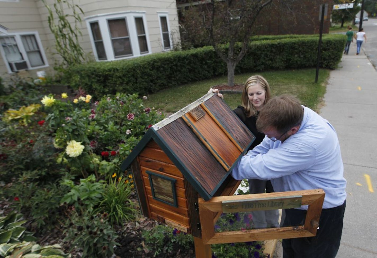 Todd Bol recently installed a Little Free Library in the front garden of the Lake Elmo Inn with the help of the owner's daughter, Laura Schiltz.