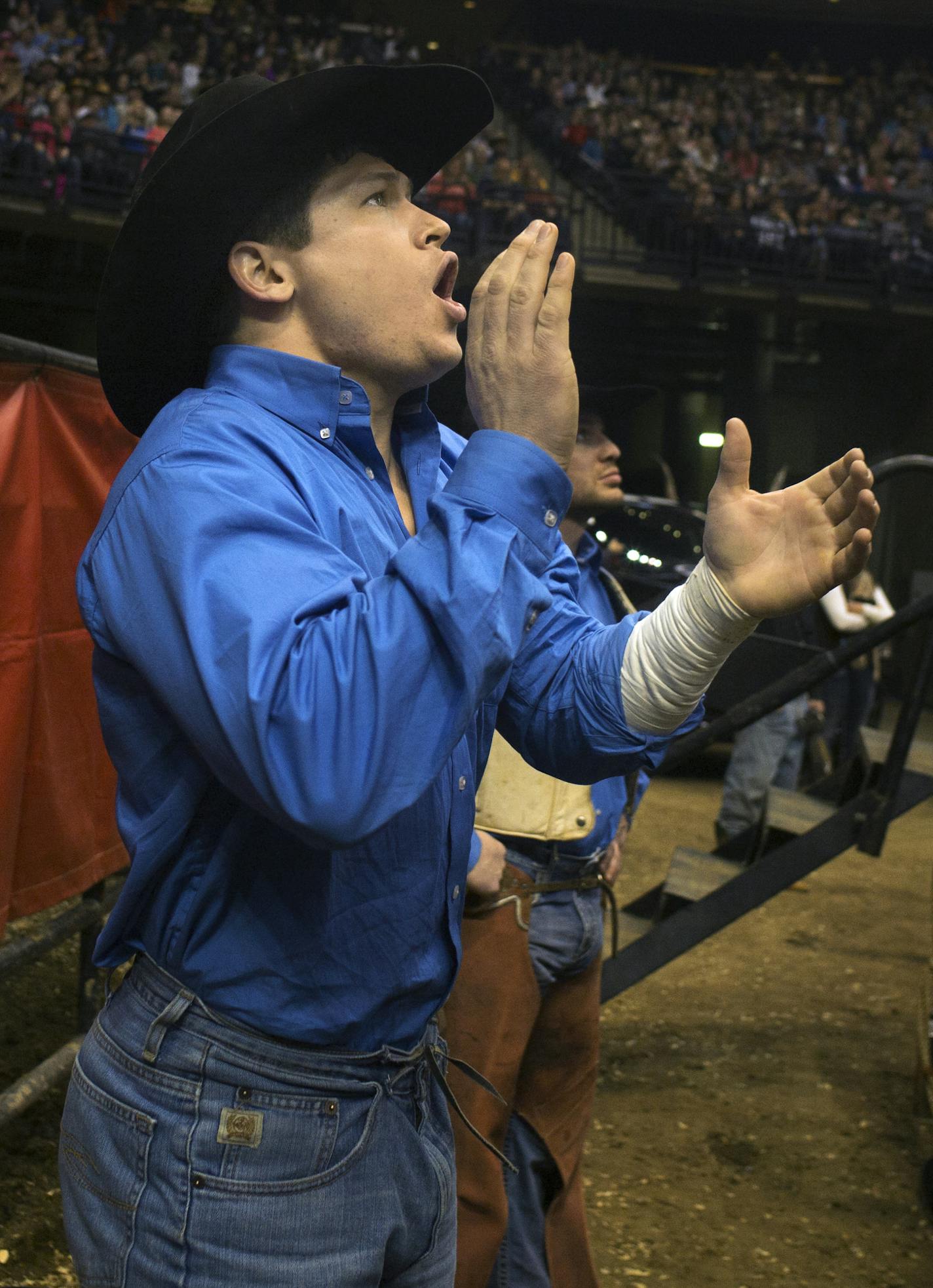 At the World's Toughest Rodeo held at the Xcel Energy Center, bareback Tanner Aus of Granite Falls cheered on his teammates behind the chutes.Richard Tsong-Taatarii/rtsong-taatarii@startribune.com