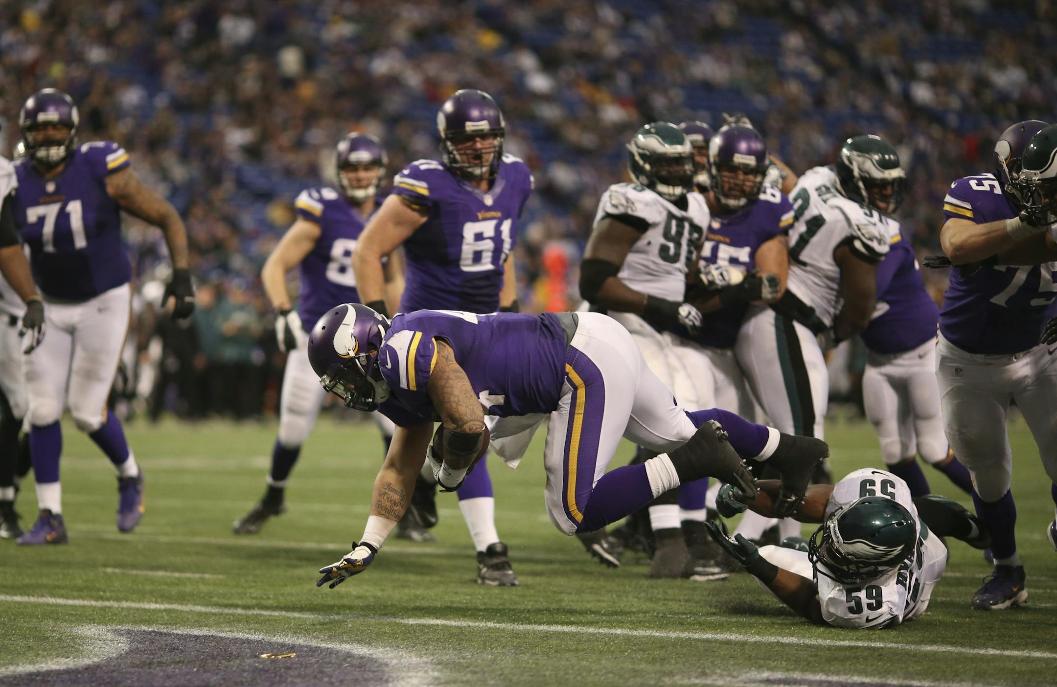 Vikings reserve running back Matt Asiata tumbled into the end zone on a 5-yard touchdown run in the fourth quarter Sunday against the Eagles, his third TD of the game.