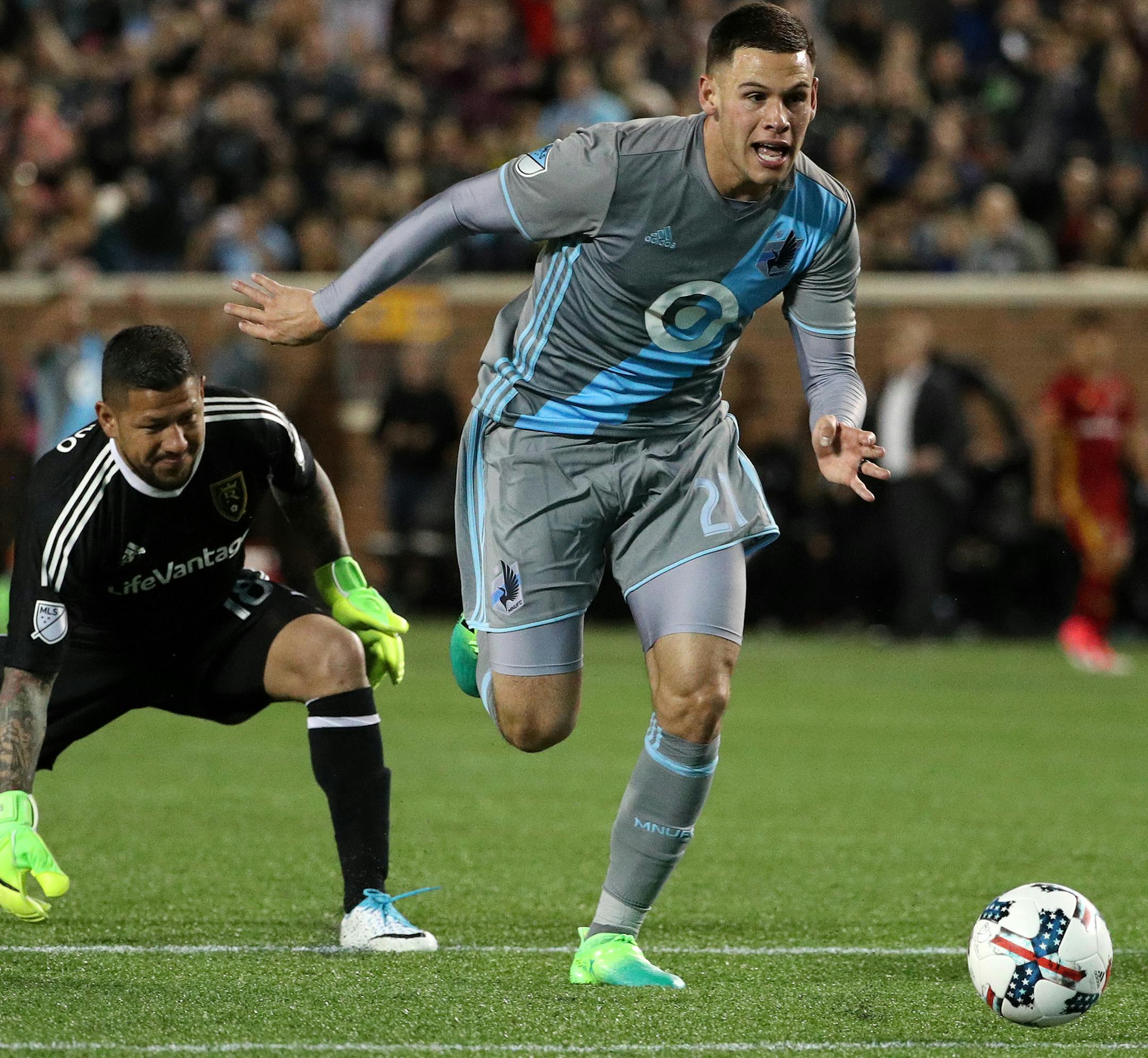 Minnesota United forward Christian Ramirez (21) took the ball from Real Salt Lake goalkeeper Nick Rimando (18) to score in the second half. ] ANTHONY SOUFFLE &#xef; anthony.souffle@startribune.com Game action from an MLS game between the Minnesota United and the Real Salt Lake Saturday, April 1, 2017 at TCF Bank Stadium on the grounds of the University of Minnesota in Minneapolis.