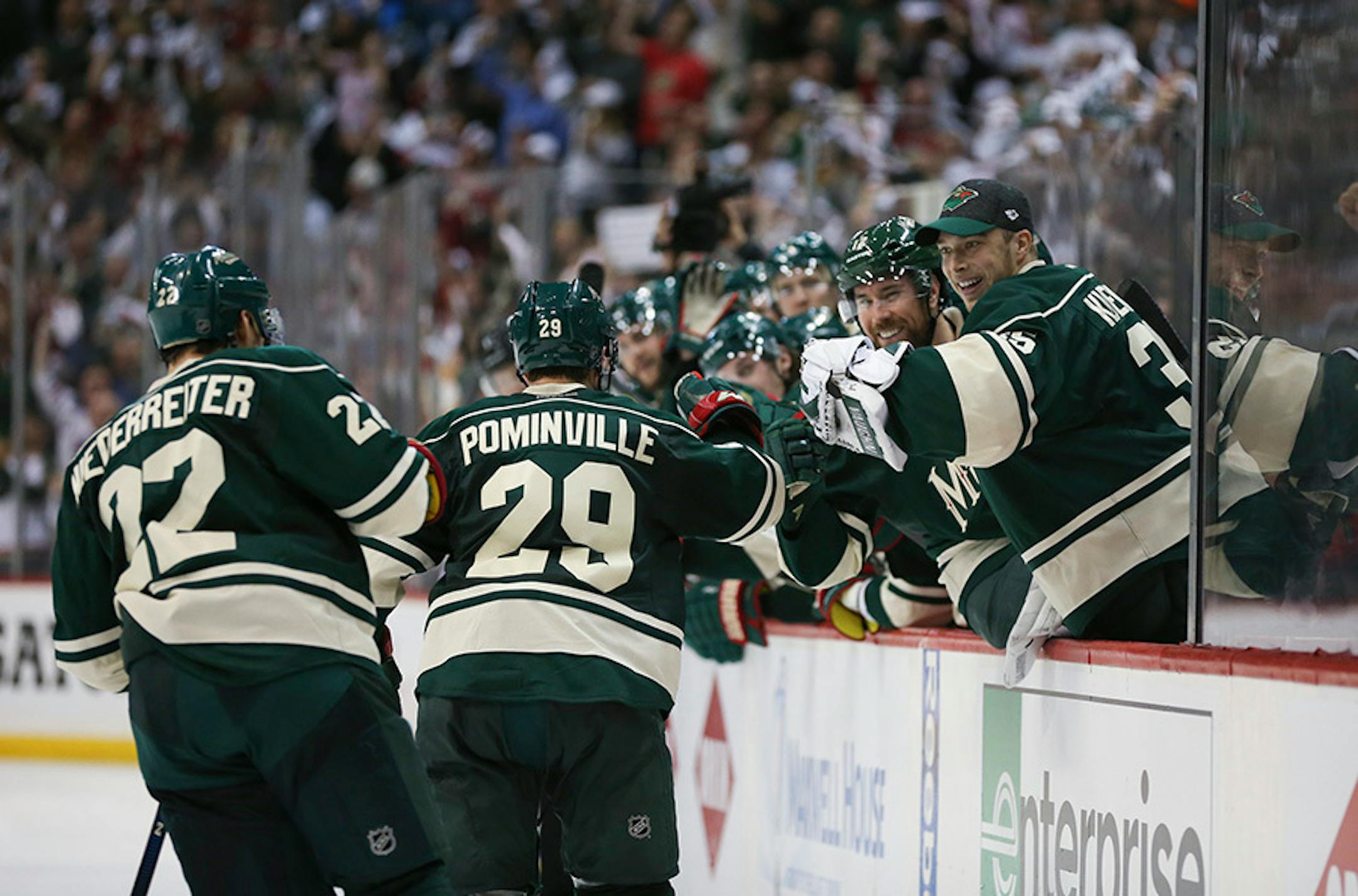 Wild right wing Jason Pominville (29) was congratulated on his go ahead goal in the second period as he skated past the Minnesota bench.