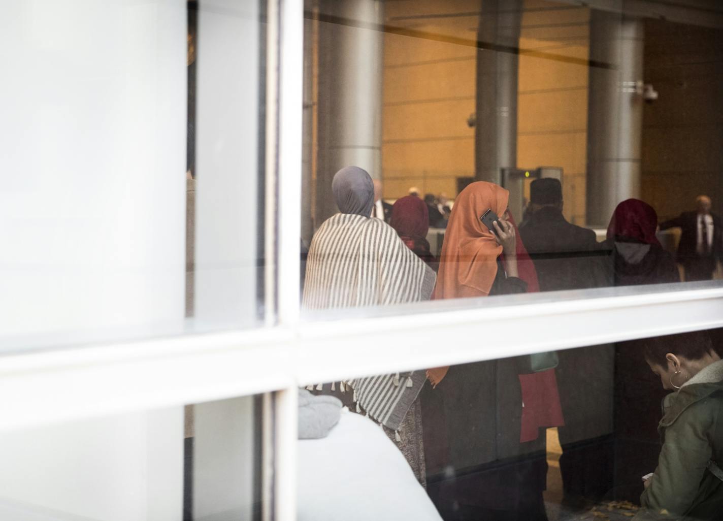 People gathered inside the Federal Courthouse before the sentencing for three of the nine ISIL recruit defendants on Monday, November 14, 2016, in Minneapolis, Minn.