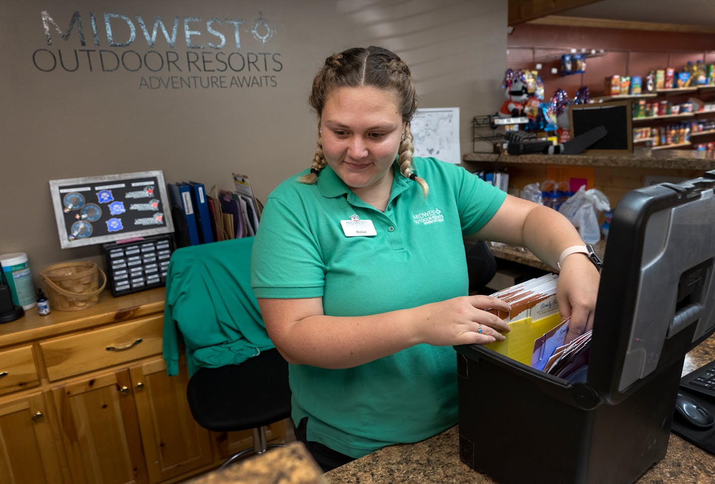 Kelsie Hemann, 23, checked paper and computer reservations at the St Croix River Resort in Hinckley.