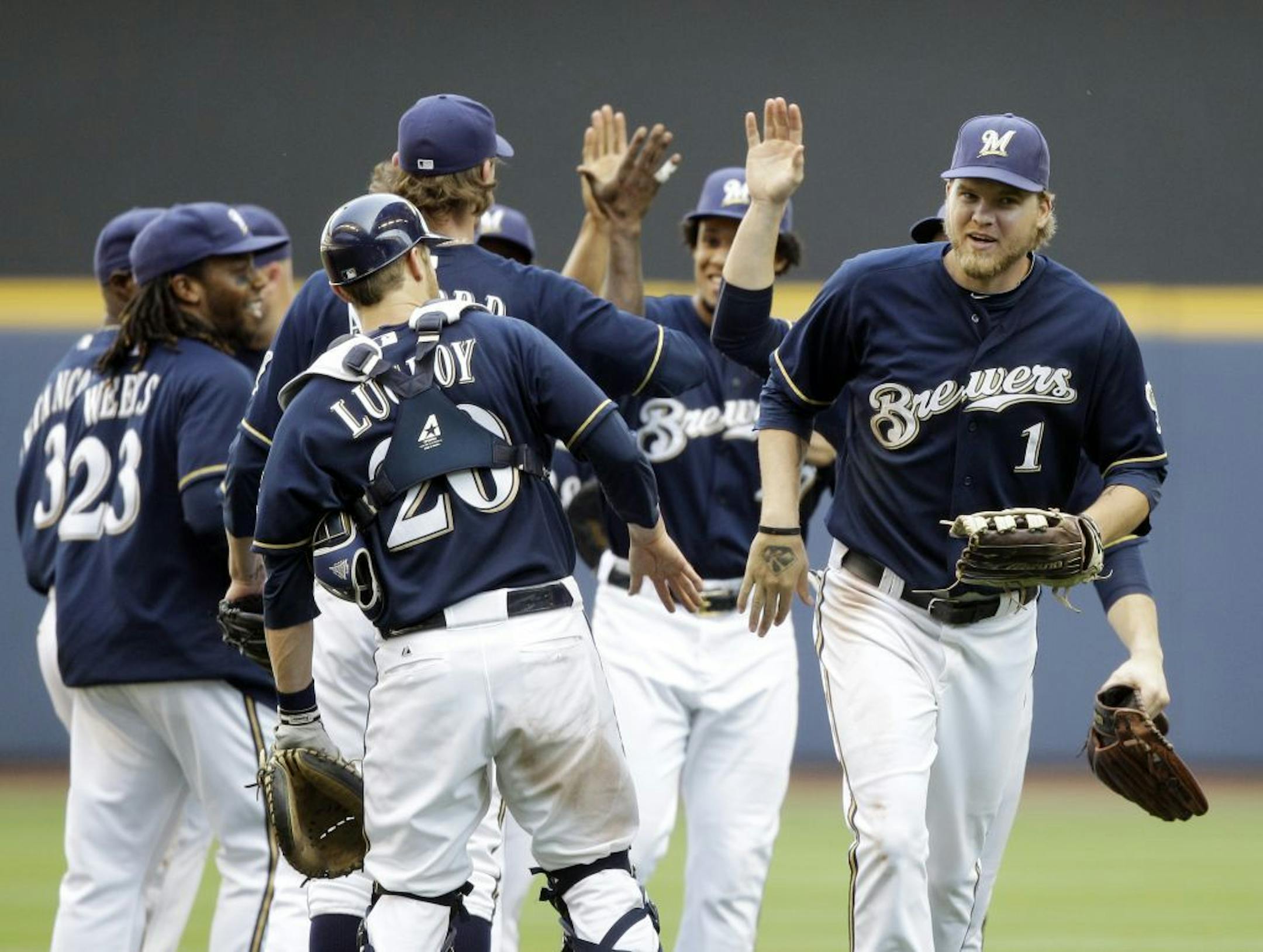 The Milwaukee Brewers celebrate after an interleague baseball game against the Minnesota Twins, Sunday, June 26, 2011, in Milwaukee. The Brewers won 6-2.