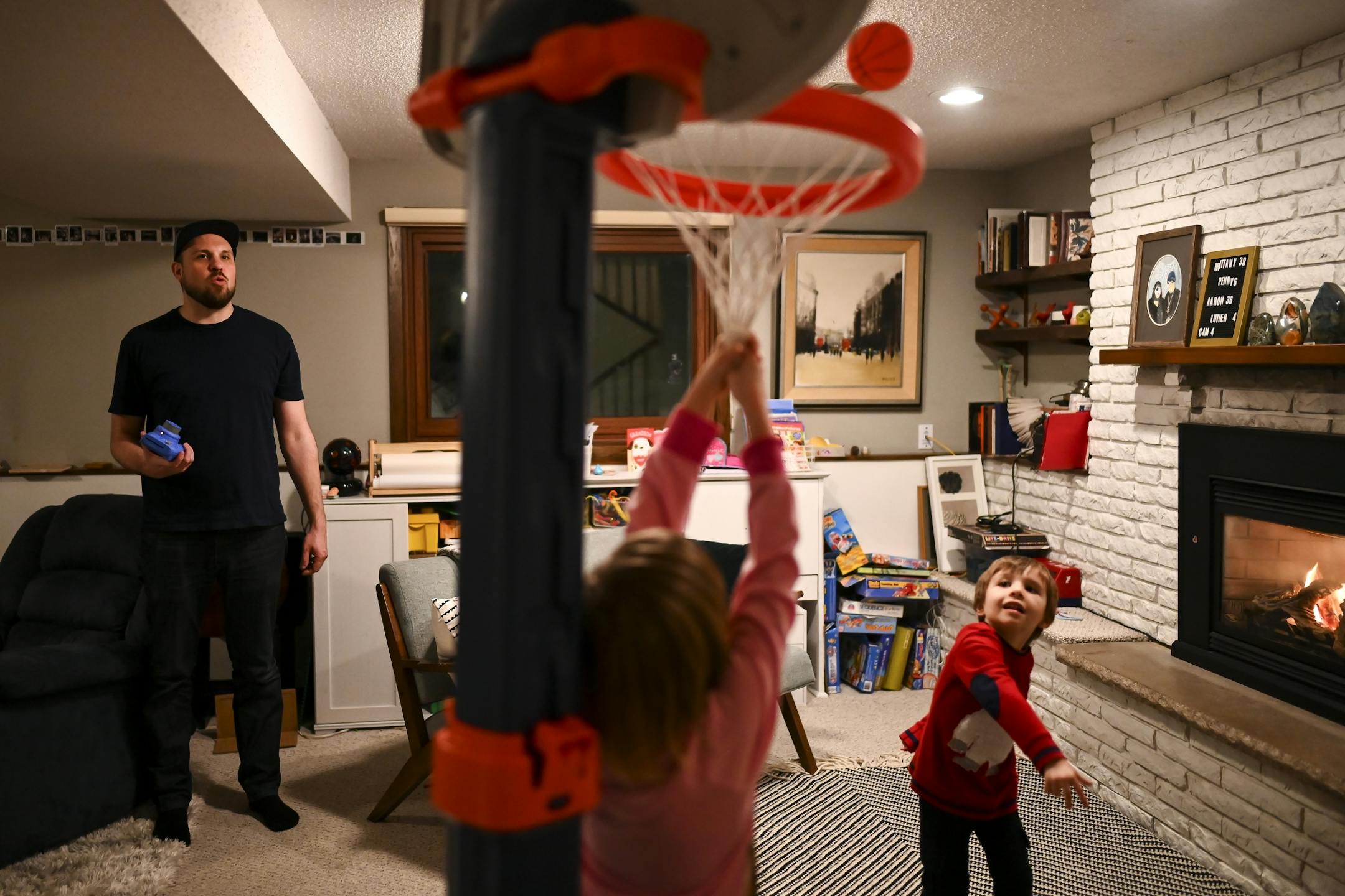 Aaron Mader watched his children Penny, 6, and Cam, 4, play in their home.