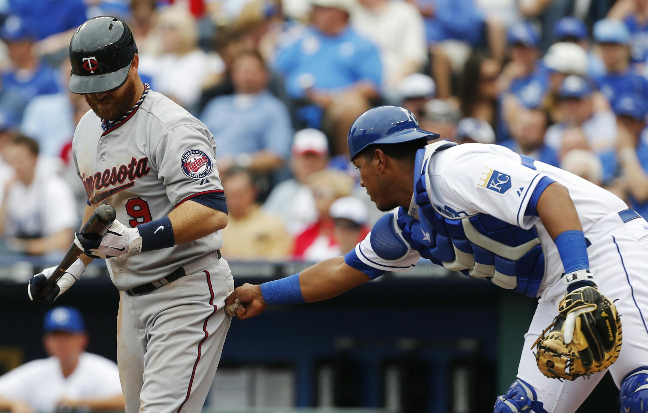 Royals catcher Salvador Perez (13) tagged out the Twins' Ryan Doumit after a strike call during the third inning Monday. Earlier, a baserunning mistake by Doumit ended a Twins rally.
