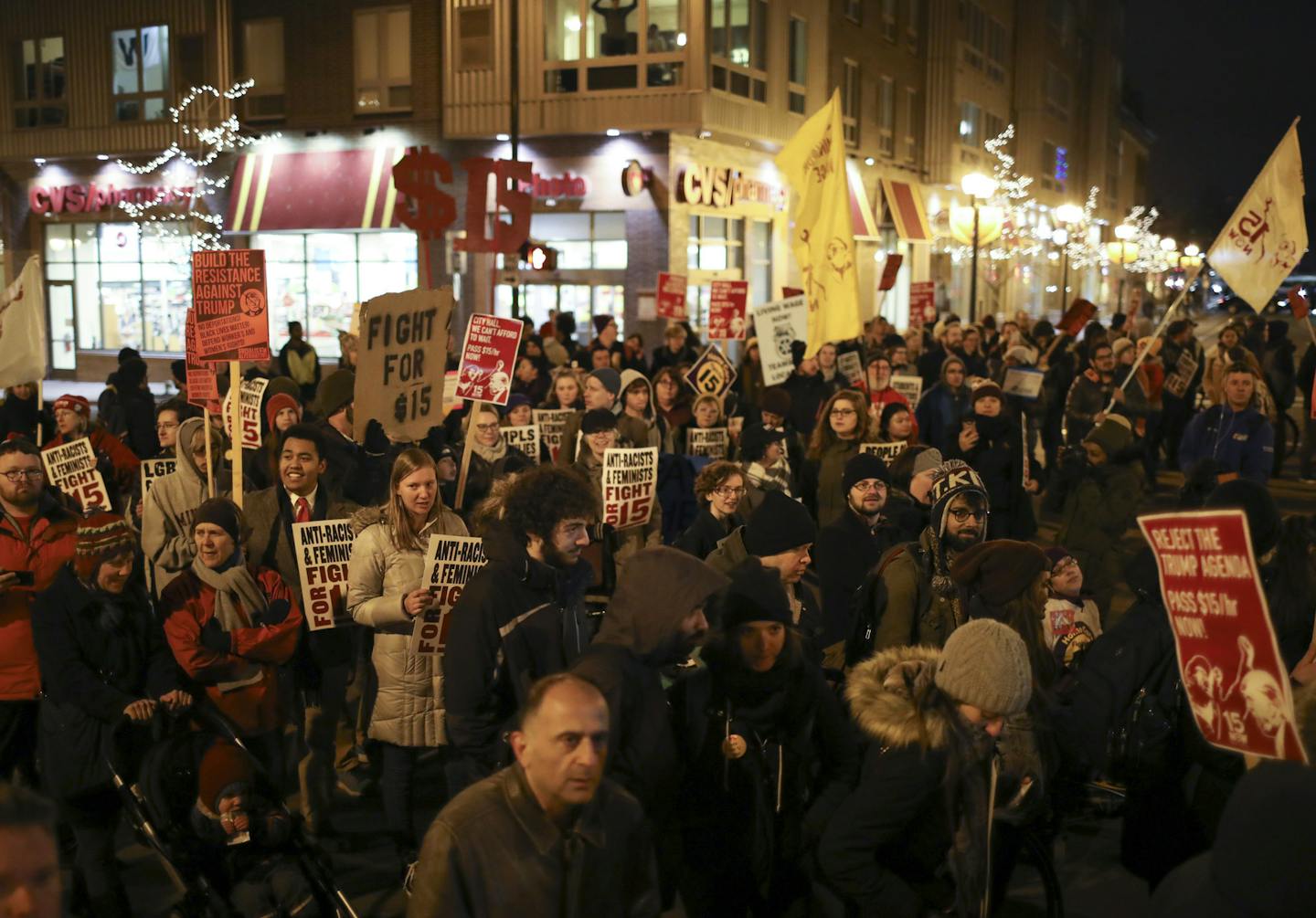 Demonstrators blocked the intersection of 15th Ave. SE and 4th St. SE in Dinkytown and listened to speakers. ] JEFF WHEELER &#xef; jeff.wheeler@startribune.com A daylong series of demonstrations in support of a $15 minimum wage that organizers called "A Day of Disruption" ended Tuesday evening, November 29, 2016 with a rally in Coffman Union on the U of M campus and a march to the intersection of 15th Ave. SE and 4th St. SE for another rally.