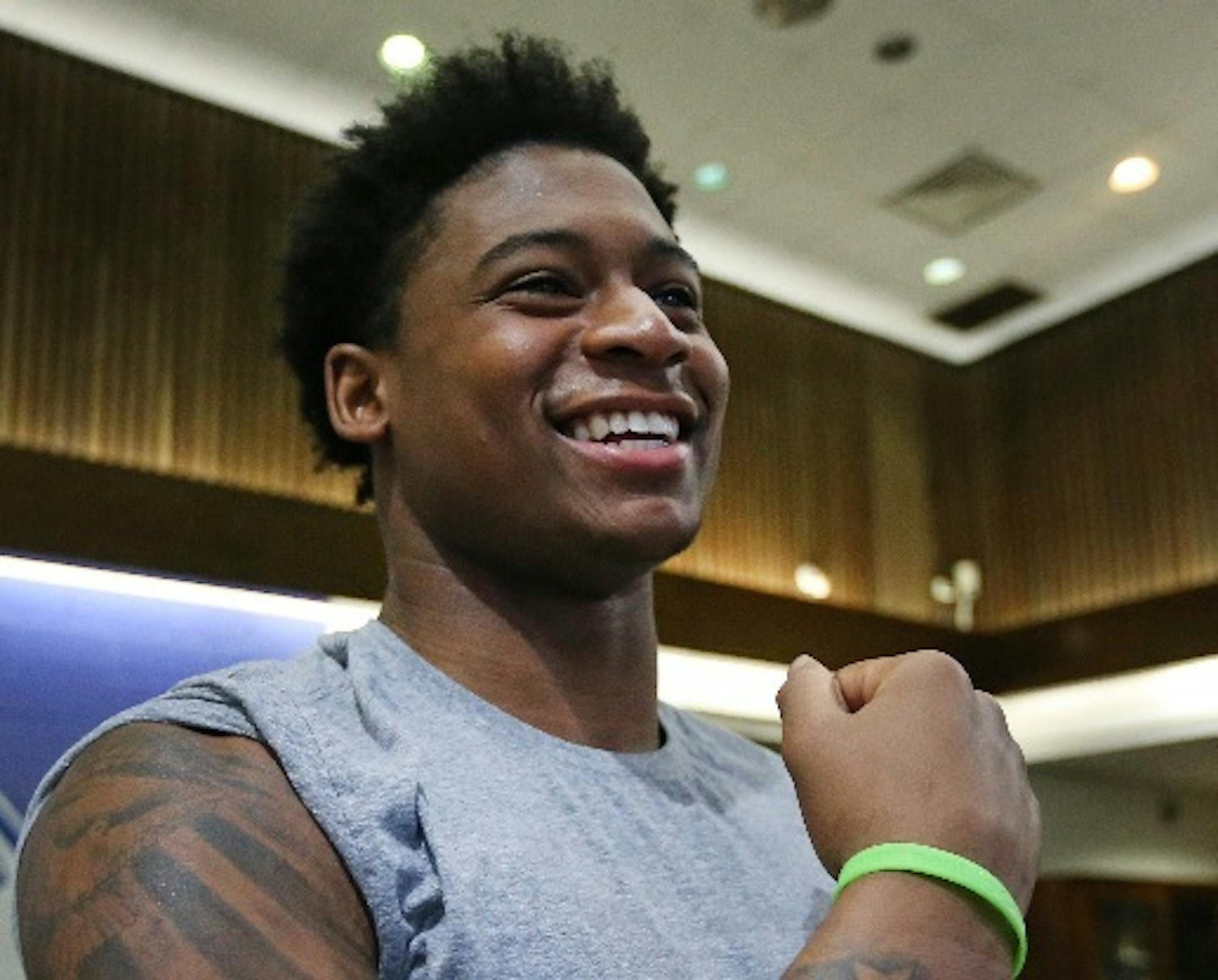Minneapolis North’s Jamire Jackson laughed before a recent practice, showing off the tattoos in memory of his father, Tony.