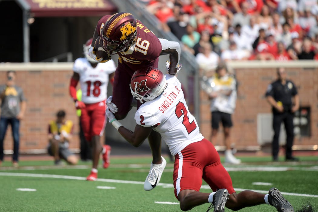 Gophers receiver Dylan Wright lunged into the end zone to score as he was tackled by Miami (Ohio)’s Cecil Singleton in the second quarter Saturday. Wright leads the team with eight catches for 130 yards and two TDs this season.
