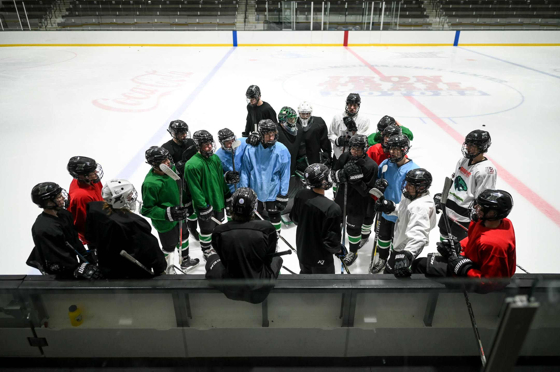 Rock Ridge players practice huddle next to their bench at the Iron Trail Motors Event Center Tuesday, Feb. 22, 2022 in Virginia, Minn.