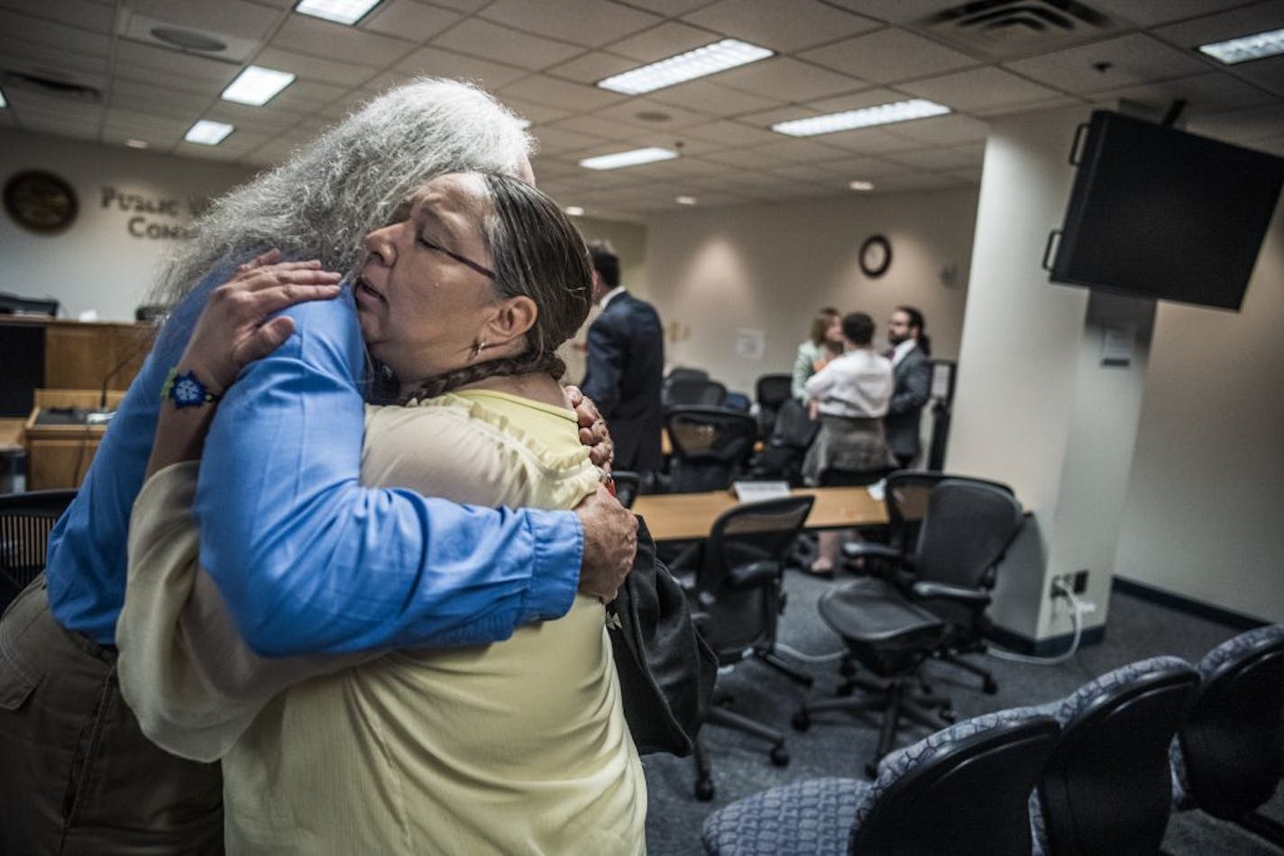 Dawn Goodwin of White Earth Reservation was comforted by Joe Plumer, attorney for White Earth and the Red Lake Bands, about the proposed Line 3 and its effects.