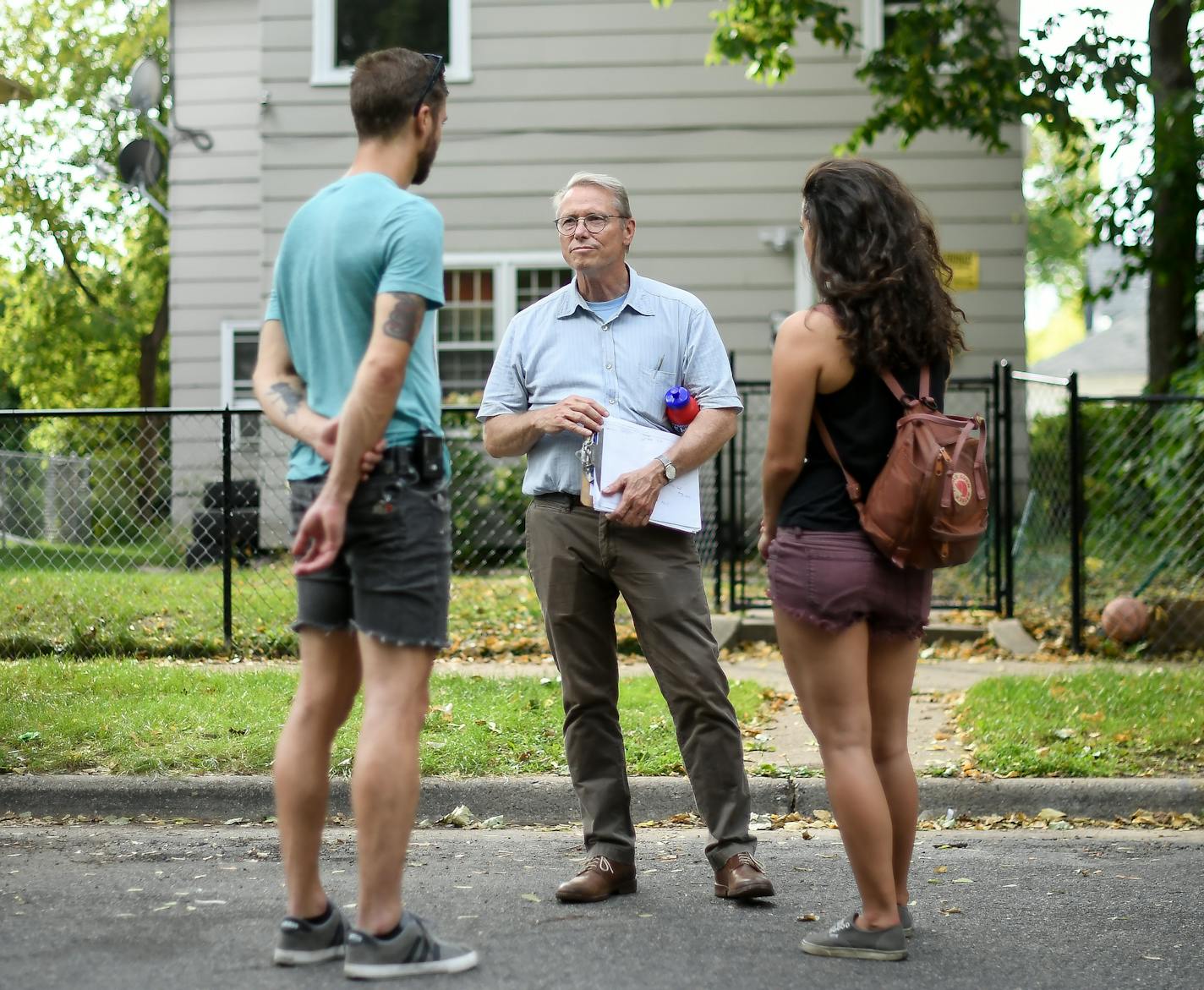 Minneapolis mayoral candidate Raymond Dehn, center, spoke to possible voters as he walked the Powderhorn Park neighborhood while promoting his campaign for mayor.