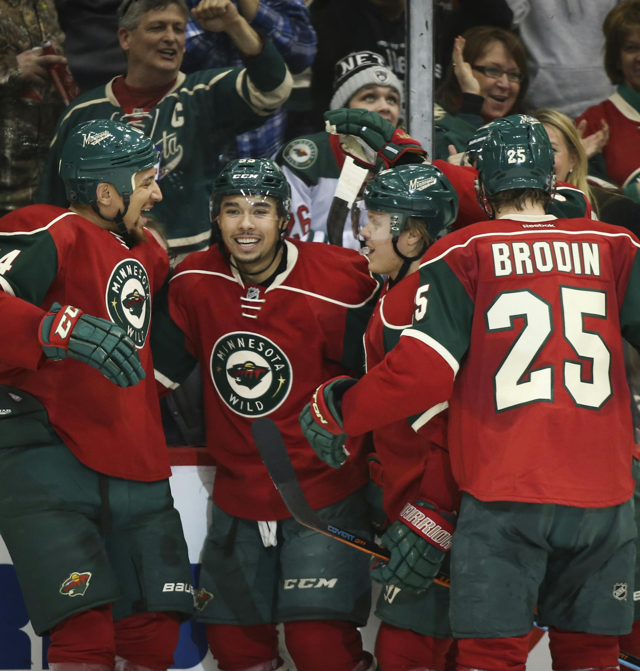 Teammates celebrated with Wild's Matt Dumba (second from left) after he scored in the second period. ] RENEE JONES SCHNEIDER • reneejones@startribune.com The Minnesota Wild played the Ottawa Senators on Tuesday, March 3, 2015 in at the Xcel Energy Center in St. Paul, Minn.