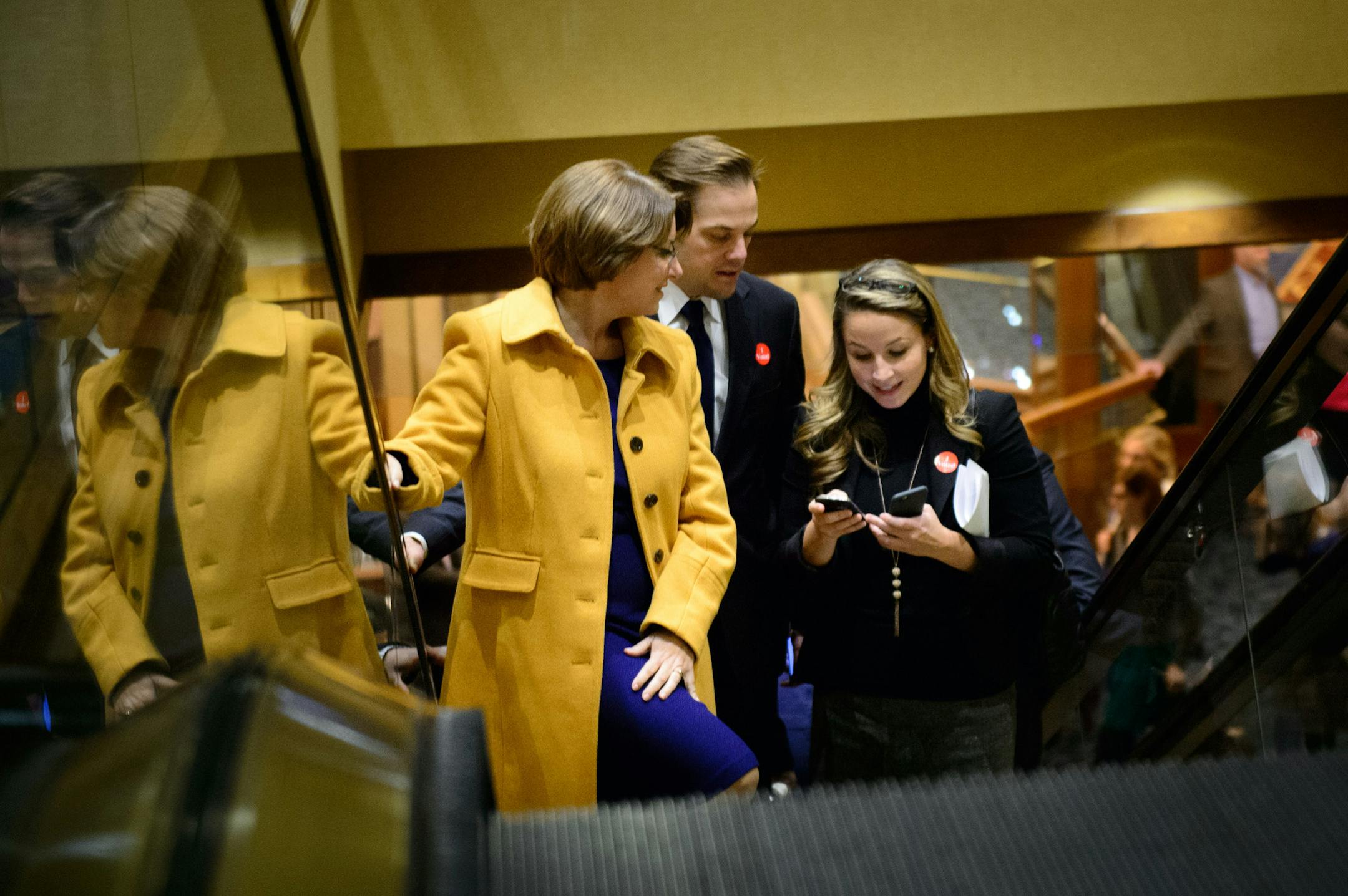 With Justin Buoen at her side, Senator Amy Klobuchar headed through the Hilton to the DFL Victory party, two years after she defeated Republican Kurt Bills by 65.2 percent to his 30.5 percent. ] GLEN STUBBE * gstubbe@startribune.com Tuesday, November 4, 2014 DFL Victory Party at the Minneapolis, Minnesota Hilton. ORG XMIT: MIN1411042235085106