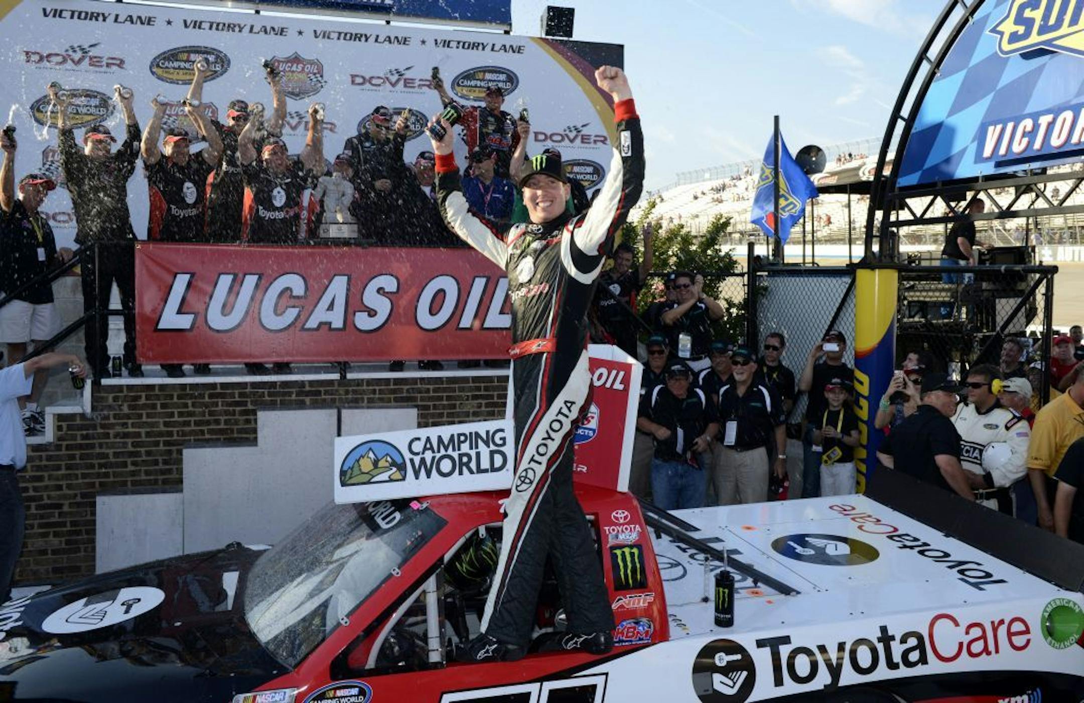 Kyle Busch celebrates in Victory Lane after he won the NASCAR Truck Series auto race, Friday, May 31, 2013, at Dover International Speedway