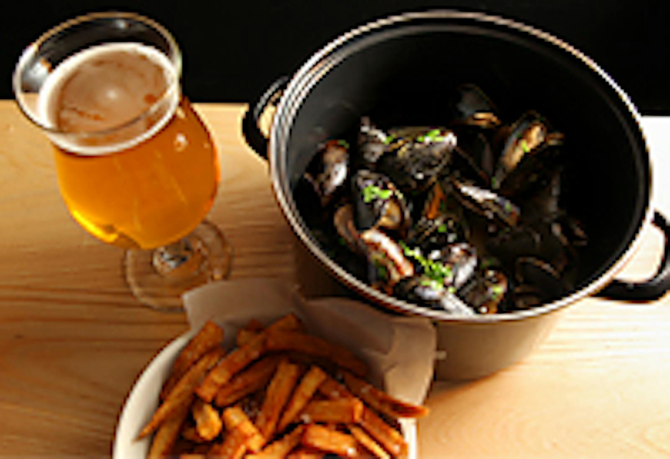 Moules Frites is mussels steamed with Wittekerke beer and bacon and served with fries