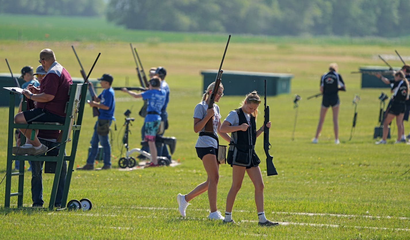 Brookelinn Finkelson and Ashley Paulson from the Ashby Arrows trap shooting team, during the competition. The Minnesota State High School Trap Shooting Championships are the largest trap shooting competition in the country — reflective of how Minnesota has cultivated competitive shooting's rise as a high-school sport. Tuesday, June 13, 2023 in Alexandria, Minn. ] Brian Peterson ¥ brian.peterson@startribune.com