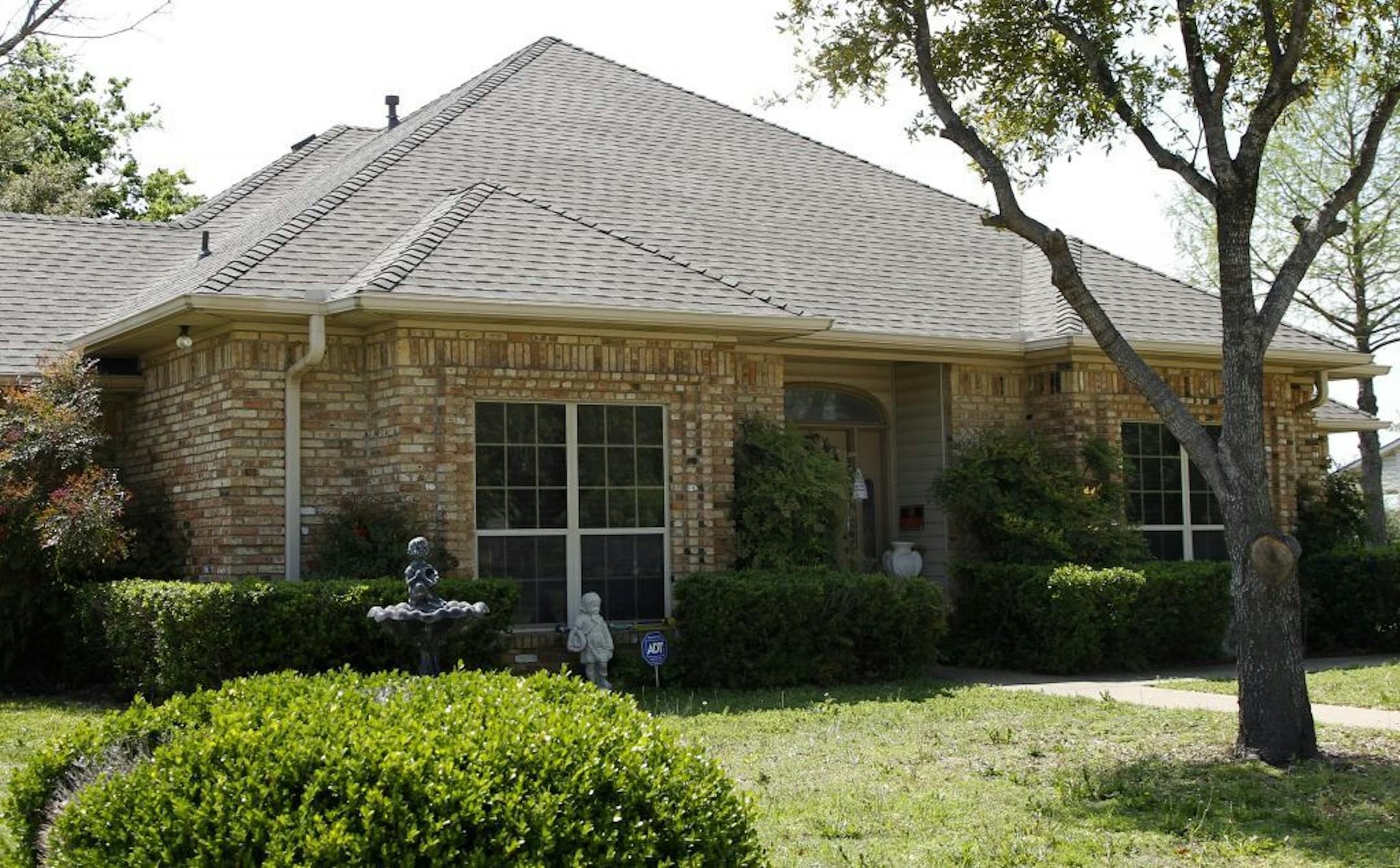 File - In this April 15, 2013 file photo, the home of Eric Lyle Williams is shown in Kaufman, Texas. Texas authorities have arrested the former justice of the peace's wife, Kim Lene Williams. Online jail records do not list charges against her and officials in Kaufman County wouldn't immediately comment on the reason for her arrest. A law enforcement official has said authorities are trying to build a case against Eric Lyle Williams in the deaths of Kaufman County District Attorney Mike McLellan