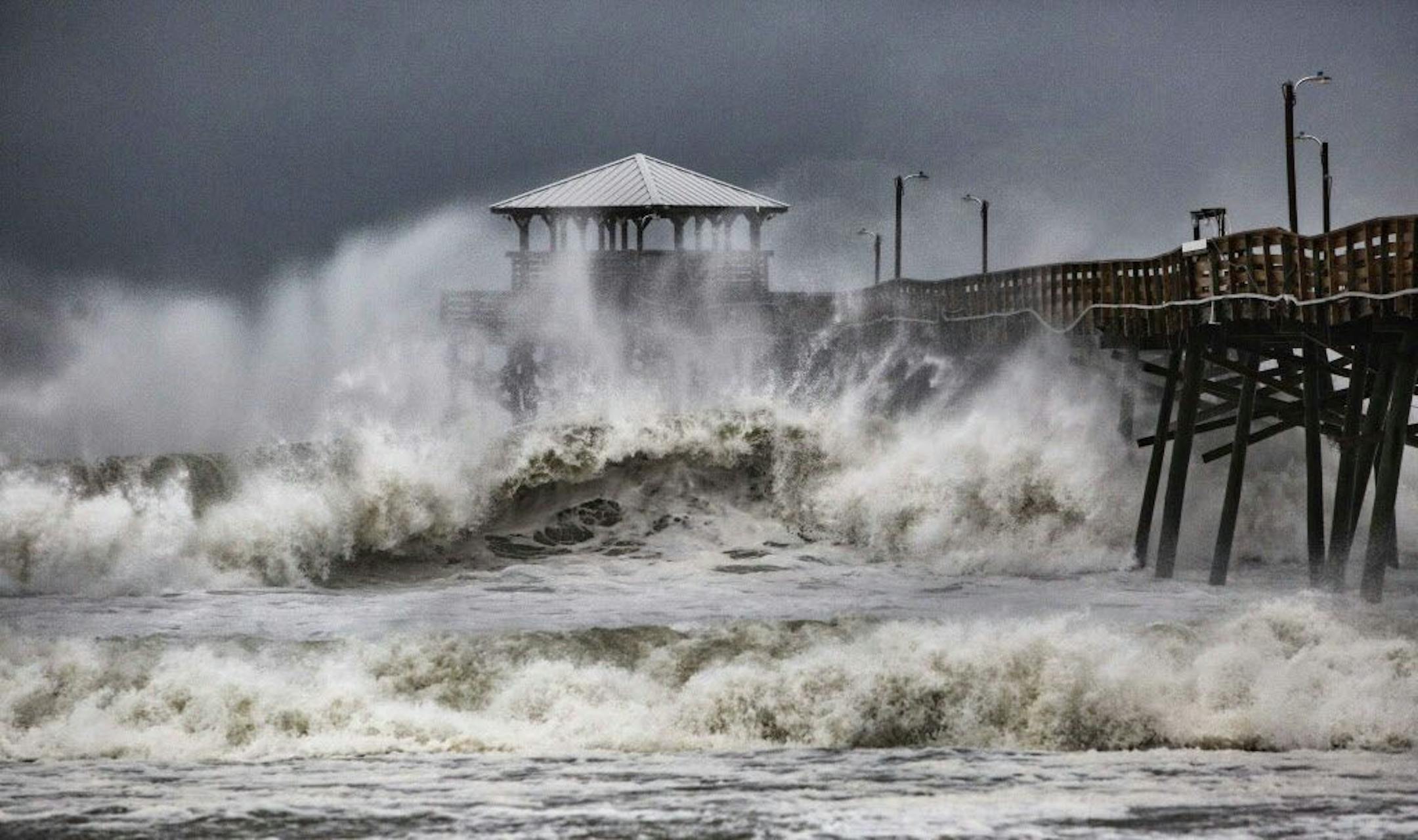 Waves slam the Oceana Pier & Pier House Restaurant in Atlantic Beach, N.C., Thursday, as Hurricane Florence approaches the area.