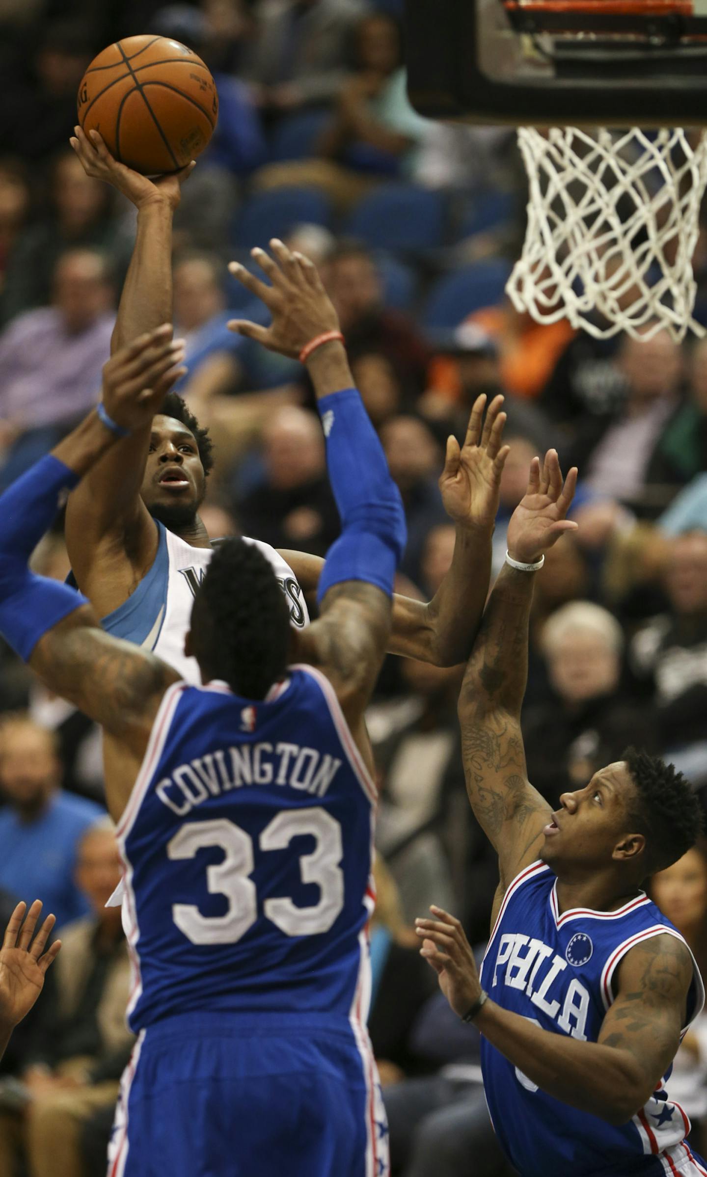 Timberwolves guard Andrew Wiggins (22) shot over Philadelphia 76ers forward Robert Covington (33) and guard Isaiah Canaan in the fourth quarter Monday night. Wiggins finished with 32 points. ] JEFF WHEELER &#xef; jeff.wheeler@startribune.com The Minnesota Timberwolves got their first home win of the season, 100-95 over the still winless Philadelphia 76ers Monday night, November 23, 2015 at Target Center in Minneapolis.