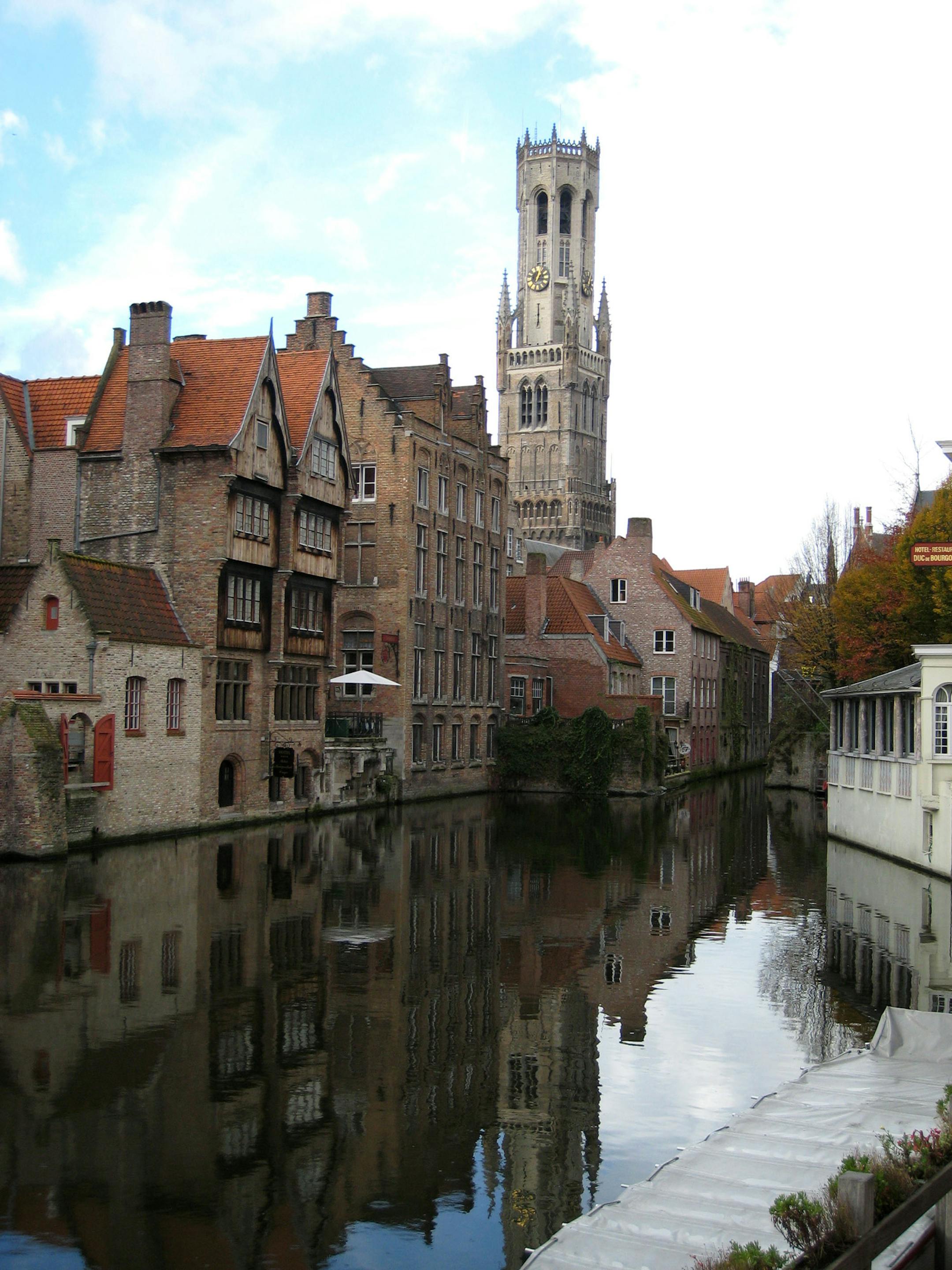 The Belfry Tower reflects into one of Brugge's many scenic canals.