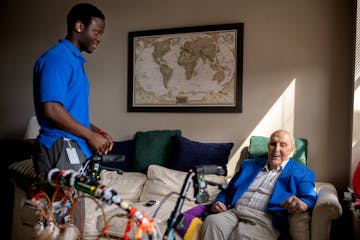 Windell Garmondeh, employee at Aurora, talked with Gerry Gilbert, a resident at Aurora on France senior living on Wednesday in Edina.