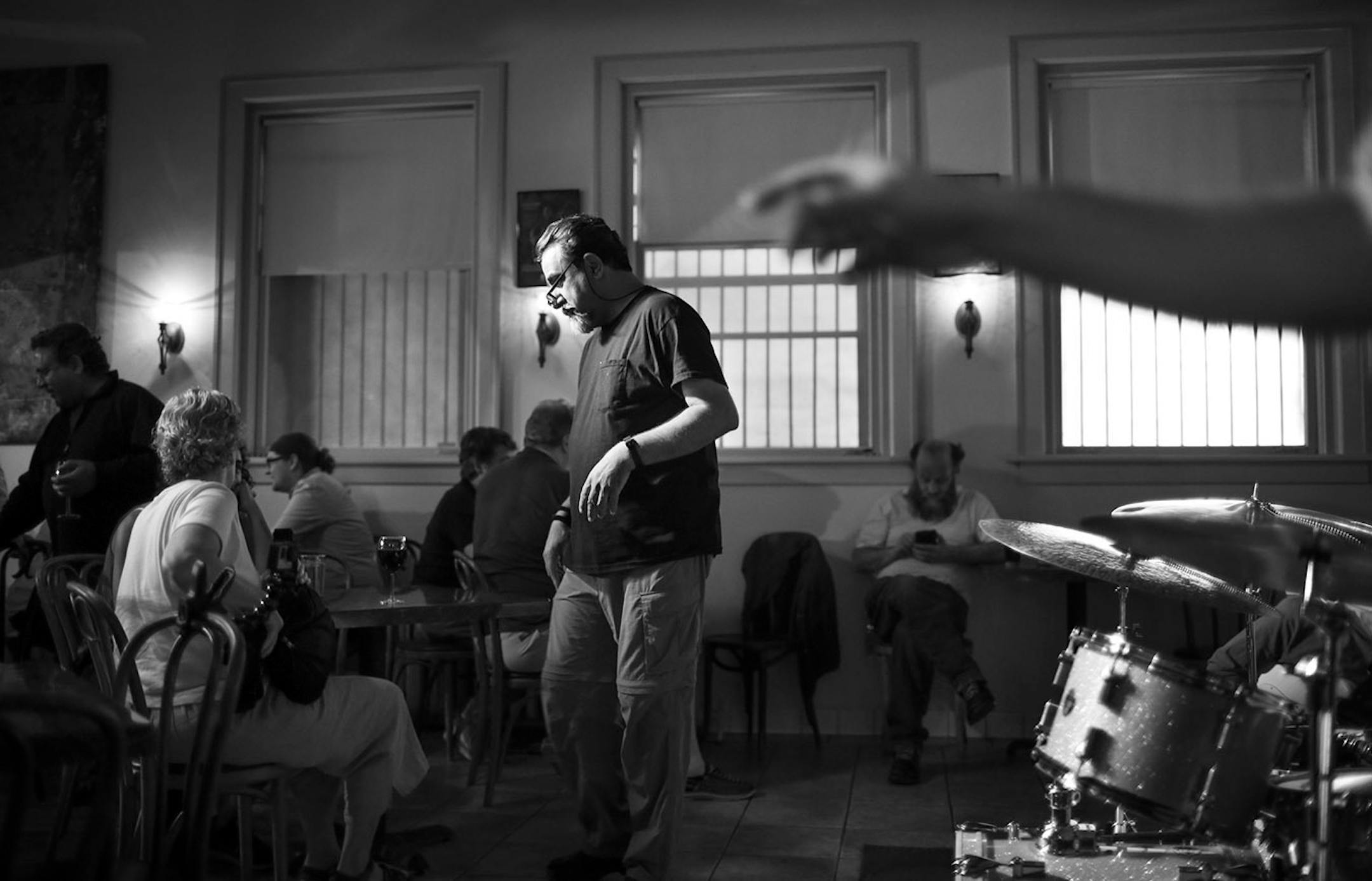 Khyber Pass owner Emel Sherzad took a table's order before the night's second jazz act performed earlier this month in his cafe.