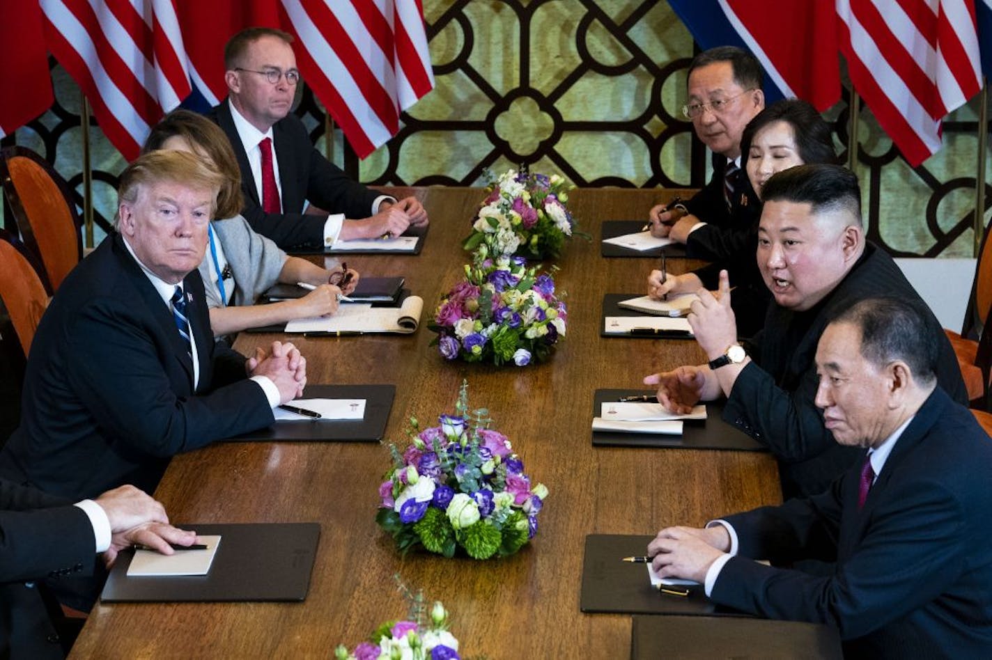 North Korea's leader, Kim Jong-un, center right, responds to reporters' questions as he meets with President Donald Trump, left, at the Metropole Hotel in Hanoi, Vietnam, on Thursday, Feb. 28, 2019. The talks ended early with the announcement that no deal had been reached.