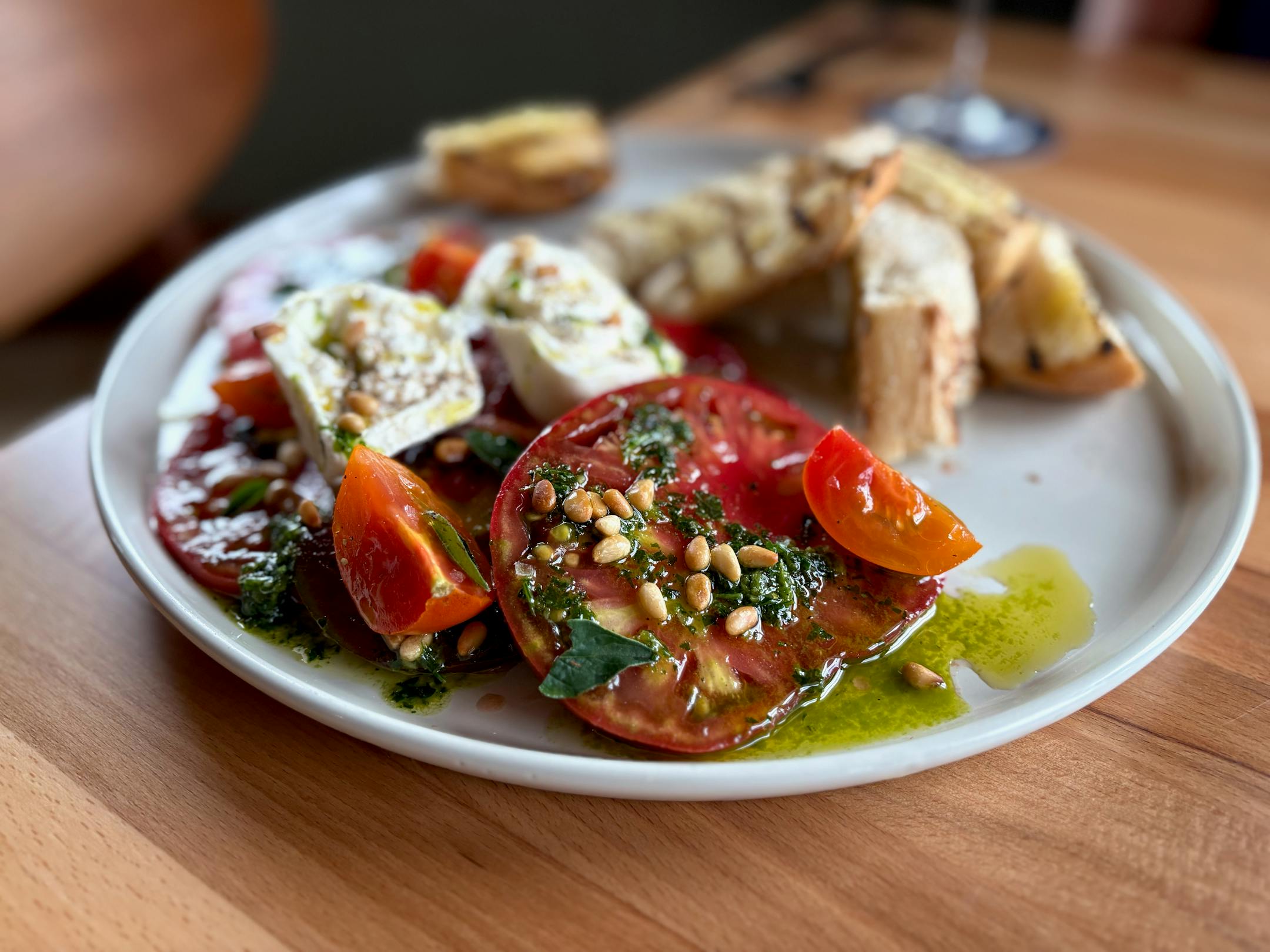 Bryndelwood tomatoes with fresh herbs, mozzarella and dressing at The Pines restaurant.