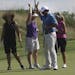 Ben Bates celebrated with his group after making a putt during a 3M Championship pro-am Tuesday. Bates, a longtime Nationwide Tour player, turned 50 i