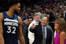 Timberwolves center Karl-Anthony Towns is congratulated by team owner Glen Taylor and his wife, Becky, after a win in 2019.