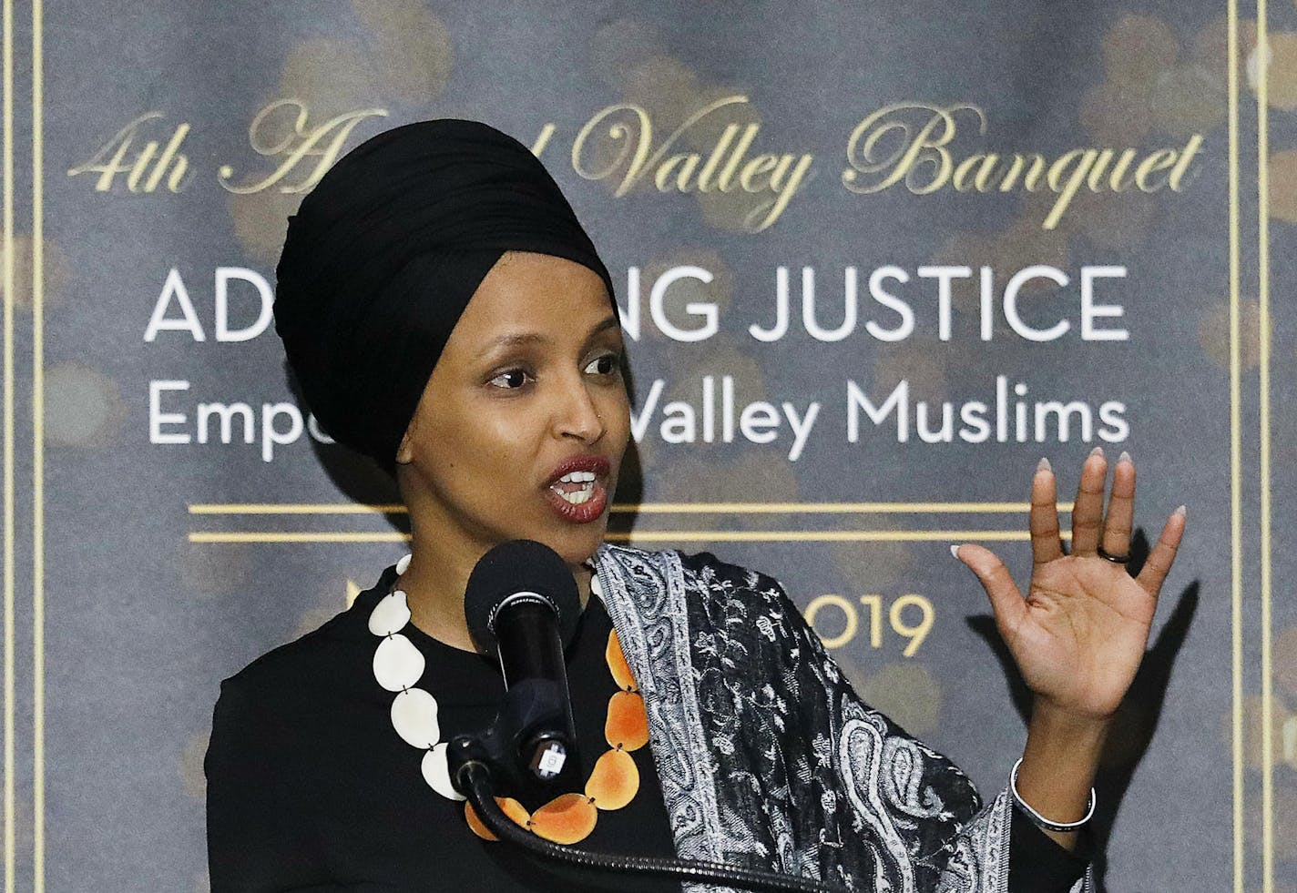 In this March 23, 2019, photo, Rep. Ilhan Omar, D-Minn., speaks at a dinner banquet, part of a fundraising event for the Council of American-Islamic Relations of Greater Los Angeles at the Hilton hotel in Woodland Hills, Calif. Hundreds of protesters rallied outside the event where the congresswoman spoke to the Muslim-American civil rights group. Omar has drawn criticism for her recent remarks on Israel, including comments that American supporters of Israel are pushing people to have "allegianc