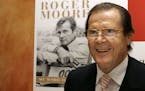 British actor Roger Moore attends a news conference to promote his latest book "The World is My Bond" in Hong Kong in 2008.