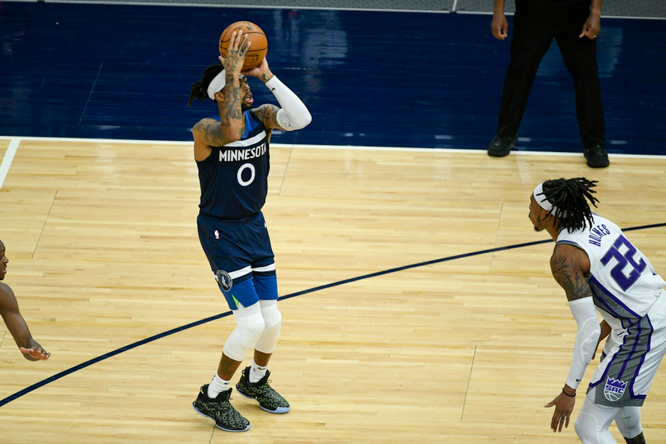 Minnesota Timberwolves guard D'Angelo Russell (0) lines up a shot Monday.