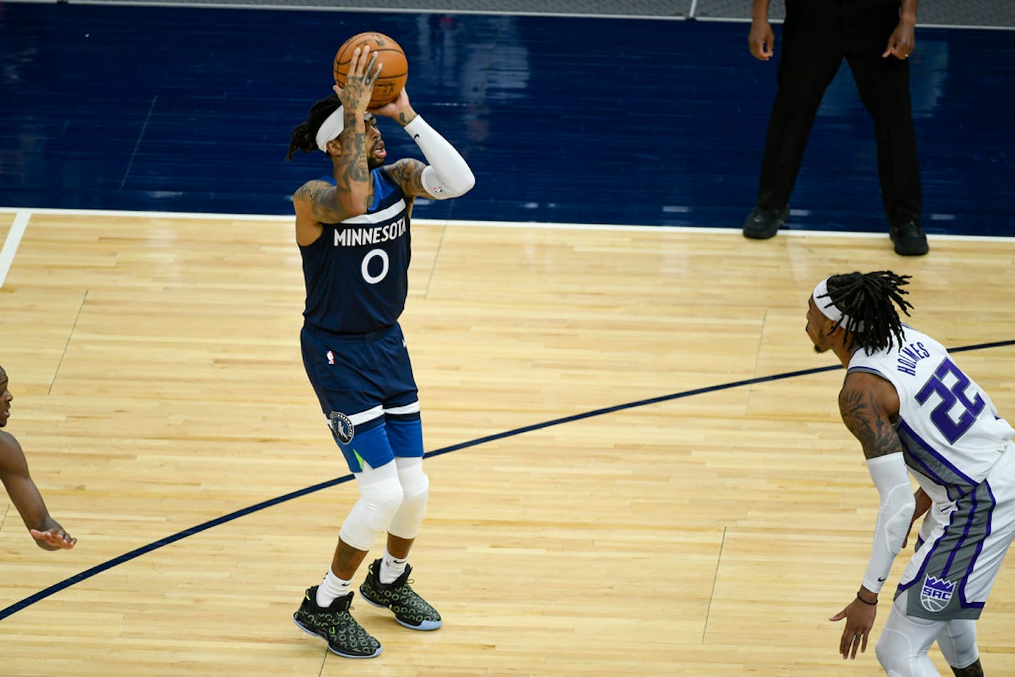 Minnesota Timberwolves guard D'Angelo Russell (0) lines up a shot Monday.