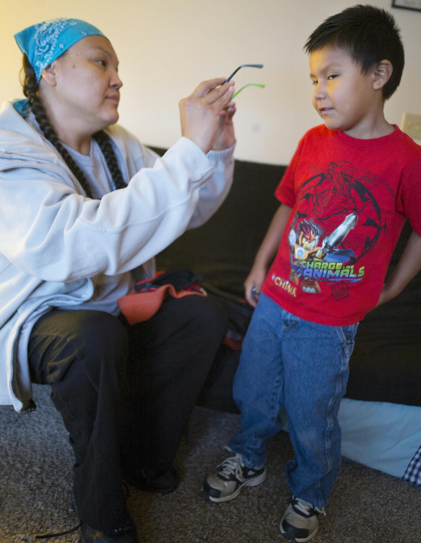 In Sioux Falls South Dakota on September 23, 2014, RN Leslie Wolfname has made a choice to maintain a lower middle class lifestyle for her family, including son Wyatt,5, instead of signing up for the Affordable Care Act. She can afford to pay for vision and dental through her employer but not the dues for health care coverage.]Richard Tsong-Taatarii/rtsong- taatarii@startribune.com