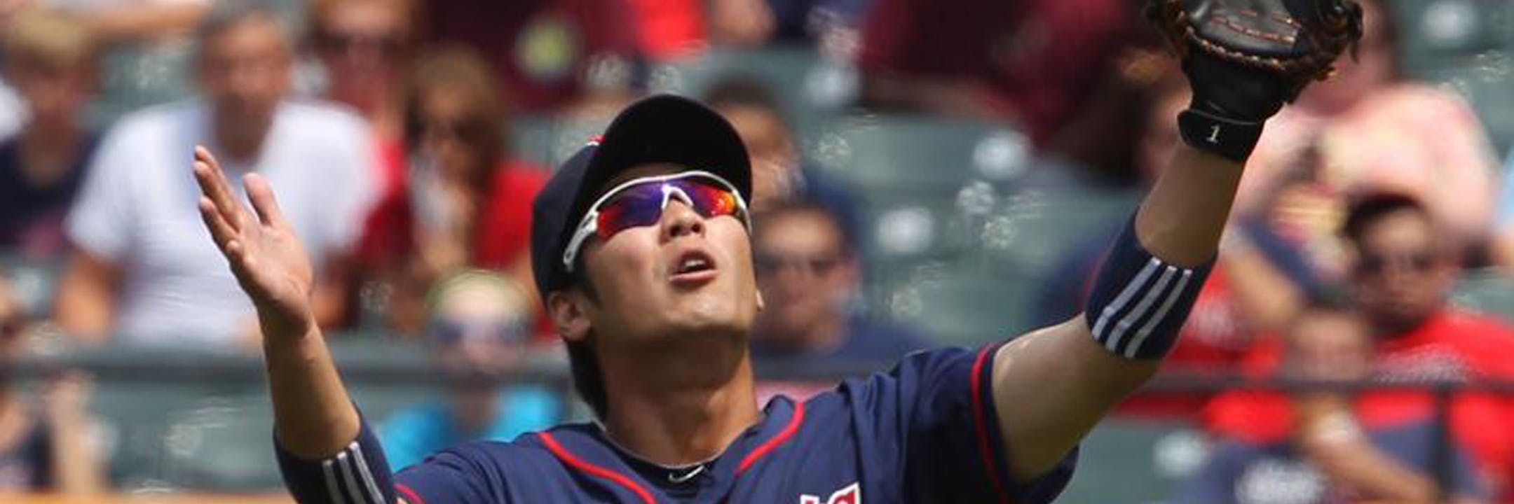 s09tribeh.jpg -- Minnesota Twins 2nd baseman Tsuyoshi Nishioka loses the pop fly hit by the Cleveland Indians Shelley Duncan in the 6th inning on August 8, 2012, at Progressive Field. Duncan was credited with a double on the play. The Indians scored 2 runs before the inning ended as the Tribe won 6-2. (Chuck Crow/The Plain Dealer) ORG XMIT: MIN2013112517545479