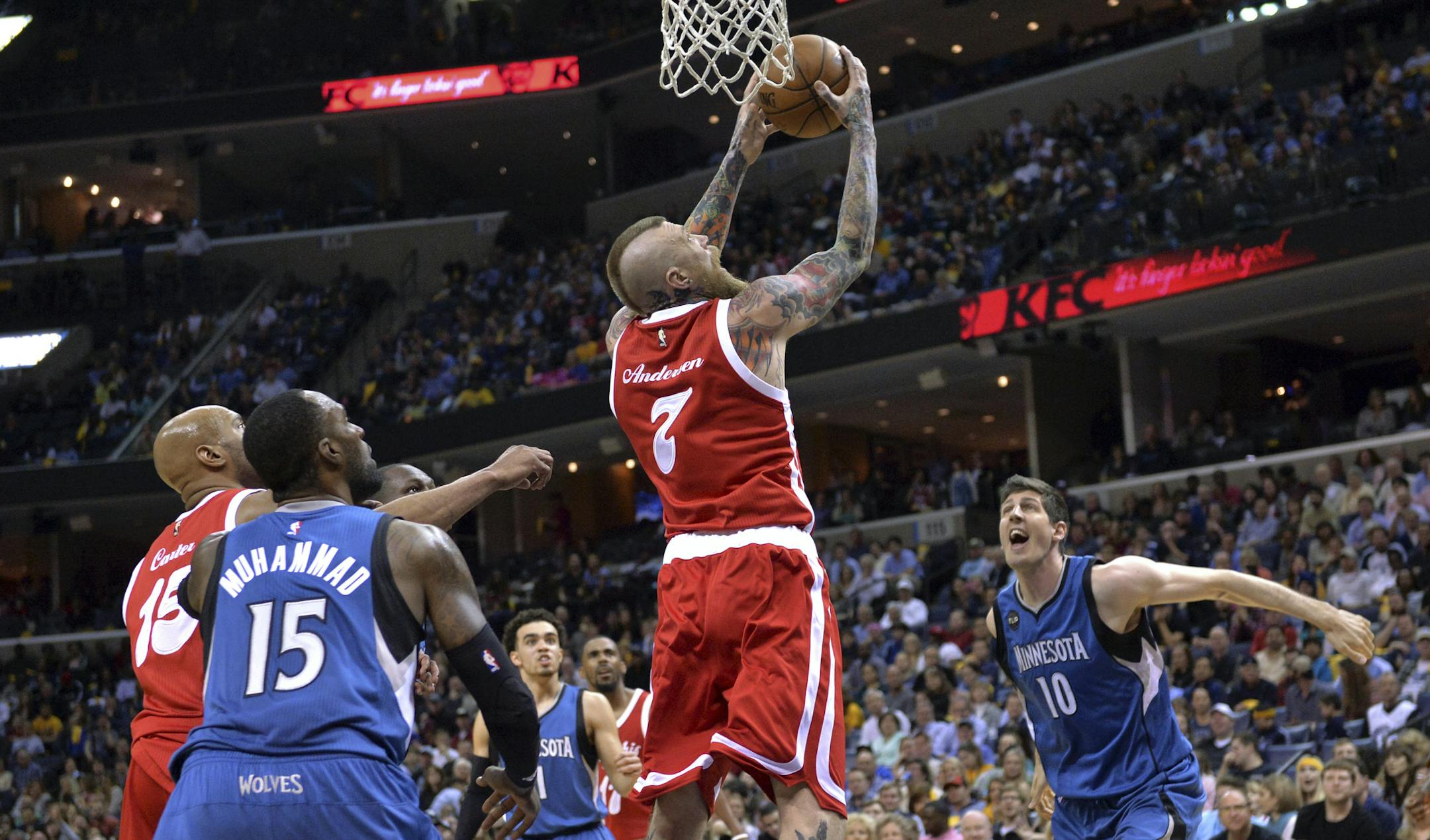 Memphis Grizzlies center Chris Andersen (7) shoots between Minnesota Timberwolves forwards Shabazz Muhammad (15) and forward Damjan Rudez (10) during the second half of an NBA basketball game Friday, Feb. 19, 2016, in Memphis, Tenn. (AP Photo/Brandon Dill)