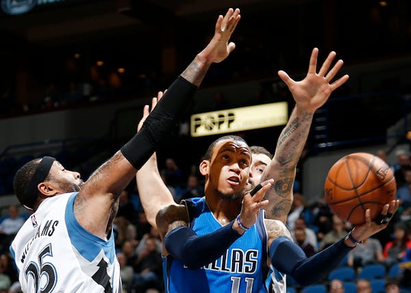 Monta Ellis (11) attempted a shot while being defended by Mo Williams (25) and Nikola Pekovic (14) in the third quarter.
