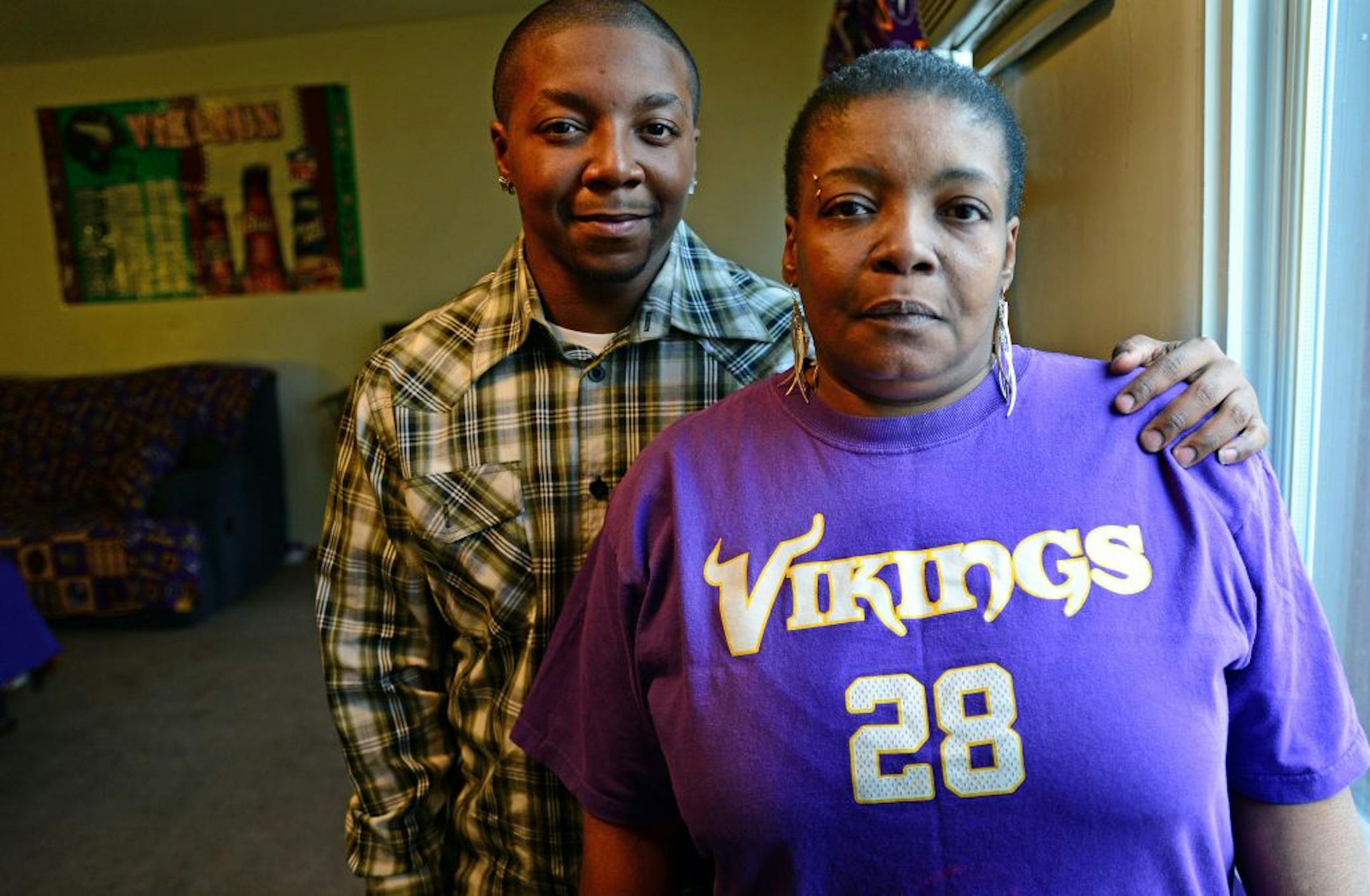 Johnnell Lane helps care for his mother, Tracee Adams, at home in Fridley.