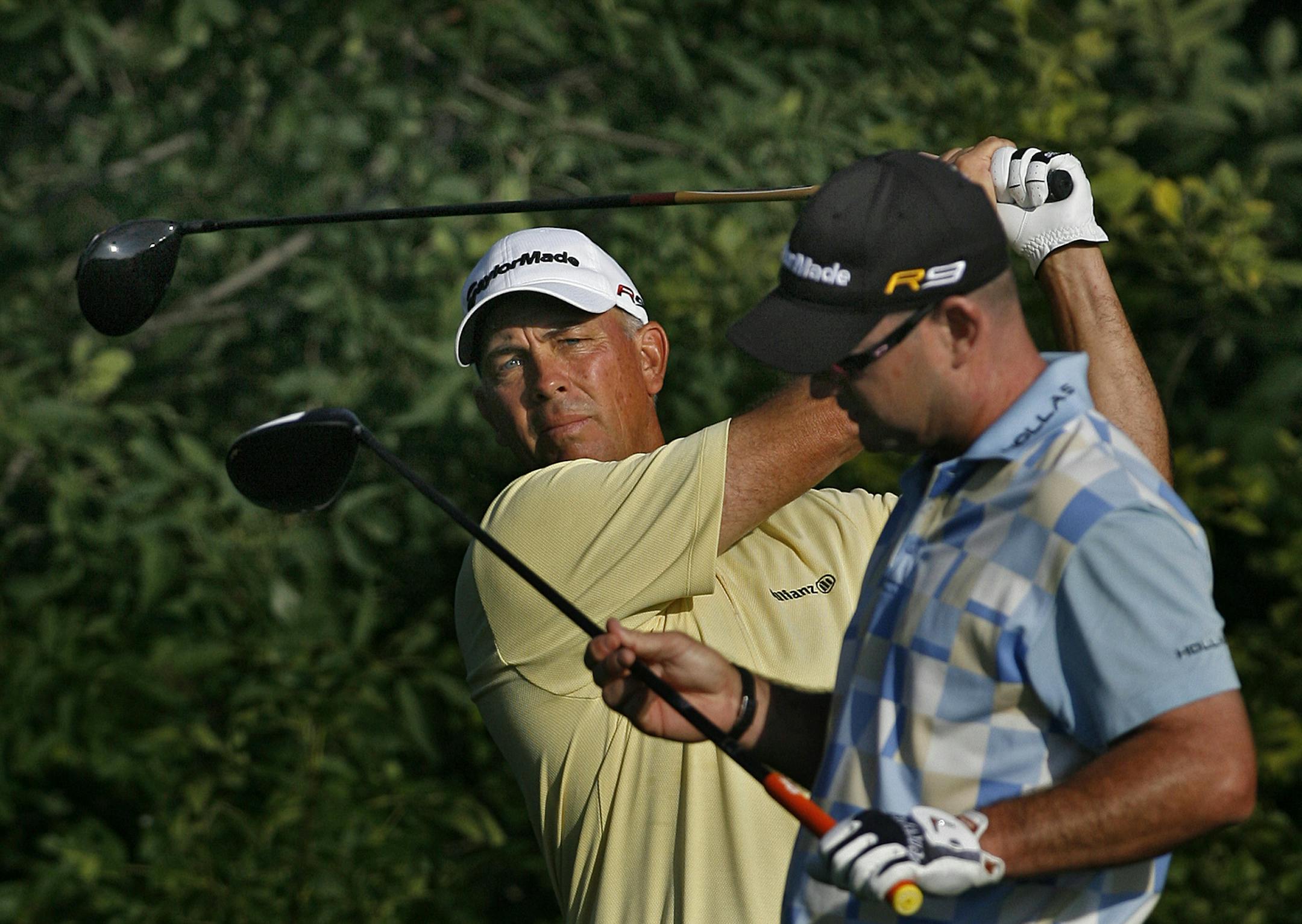 JIM GEHRZ • jgehrz@startribune.com Chaska/August 13, 2009/7:30 AM } Tom Lehman (left) and Rory Sabbatini warmed up on the 10th tee as they began their opening round of play at the 91st PGA Championship at Hazeltine National Golf Club in Chaska.
