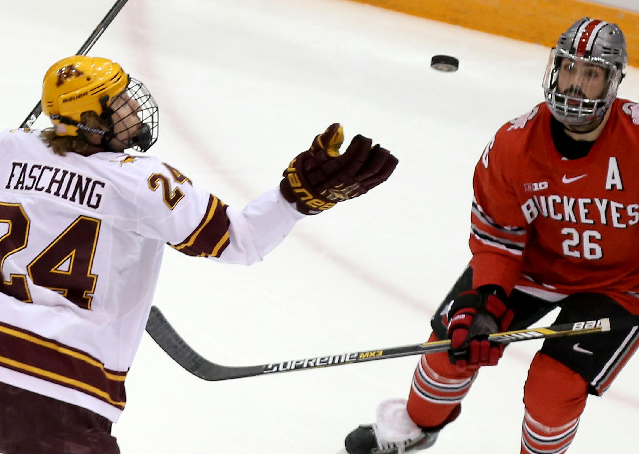 The University of Minnesota Gophers Hudson Fasching (24) gloves a puck in front of Ohio State's Matt Johnson (26) during the first period Friday, Feb. 6, 2015, at Mariucci Arena in Minneapolis, MN.](DAVID JOLES/STARTRIBUNE)djoles@startribune.com Gophers men's hockey versus Ohio State Friday, Feb. 6, 2015, at Mariucci Arena in Minneapolis, MN.**udson Fasching, Matt Johnson ,cq