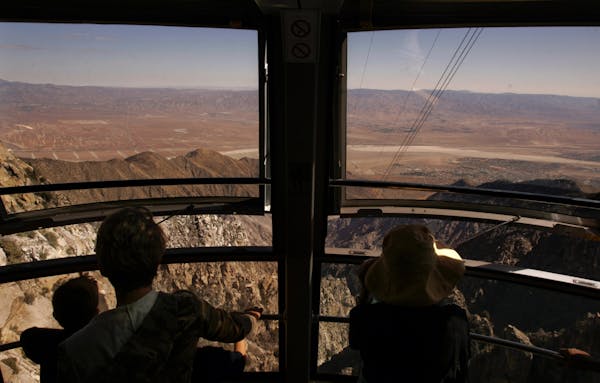 Visitors take in breathtaking views from the aerial tramway overlooking the San Jacinto Mountains in Palm Springs, Calif. The tram whisks you up to an