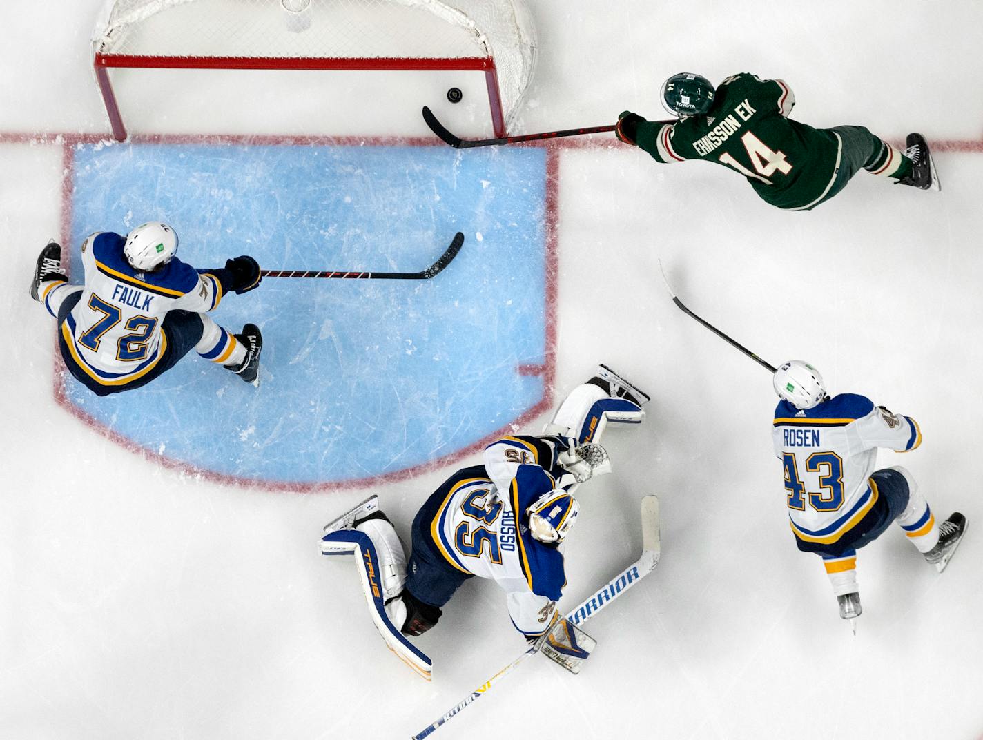 Joel Eriksson Ek (14) of the Minnesota Wild gets the puck past St. Louis Blues goalie Ville Husso for a goal in the second period Tuesday, May 4, at Xcel Energy Center in St. Paul, Minn. Game 2 of the NHL playoffs Minnesota Wild vs. St. Louis Blues. ] CARLOS GONZALEZ • carlos.gonzalez@startribune.com