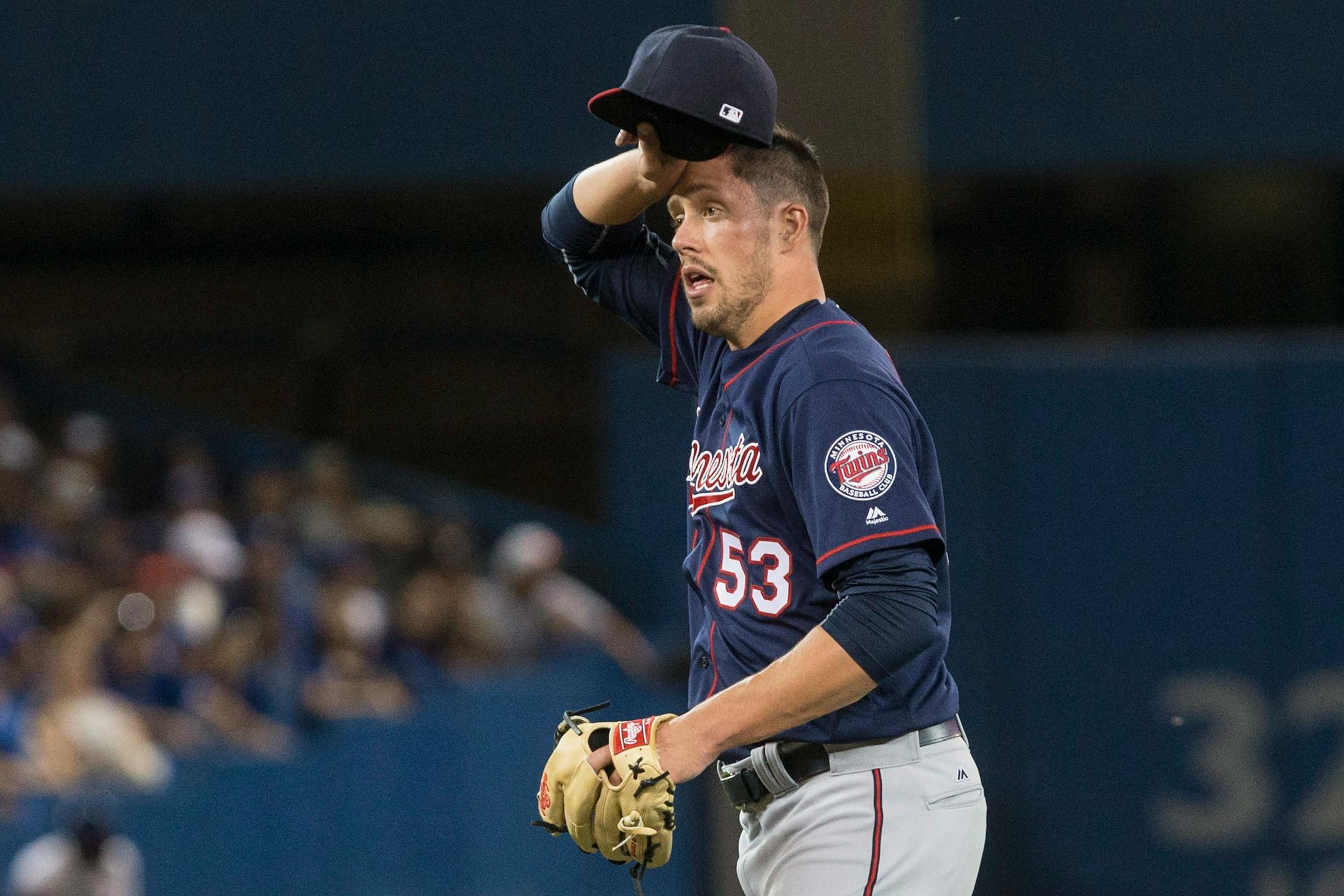 Minnesota Twins relief pitcher Pat Light reacts during sixth-inning baseball game action against the Toronto Blue Jays in Toronto, Friday, Aug. 26, 2016. (Chris Young/The Canadian Press via AP)