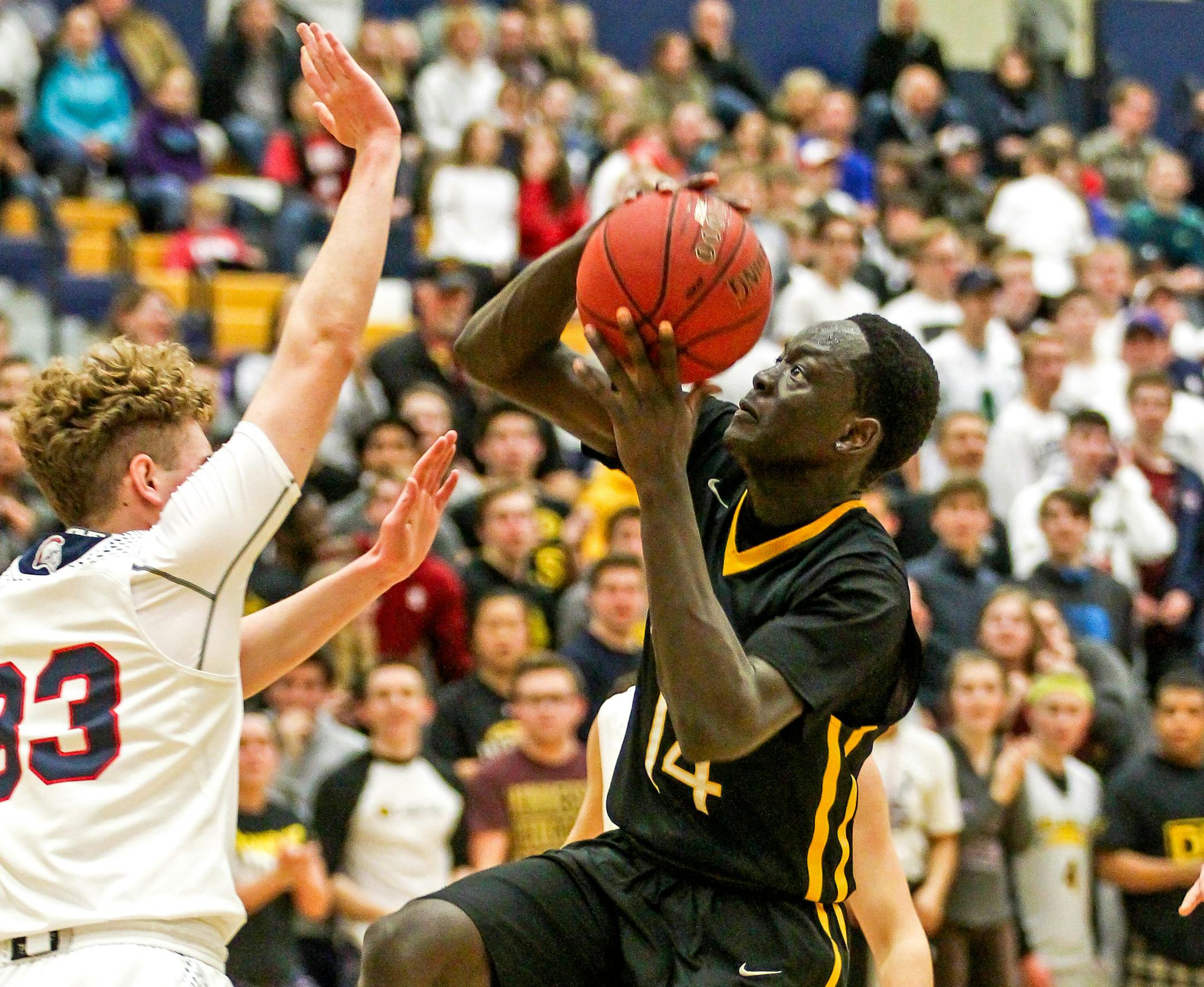 Goanar Mar, right, drives to the basket on Orono defender Blake O&#xed;Connor. Mar scored 25 points (on scoreboard, check against boxscore) in De La Salle&#xed;s 71-68 victory in the Class 3A Section 6 boys&#xed; basketball championship game at Chanhassen High School. Photo by Mark Hvidsten, SportsEngine