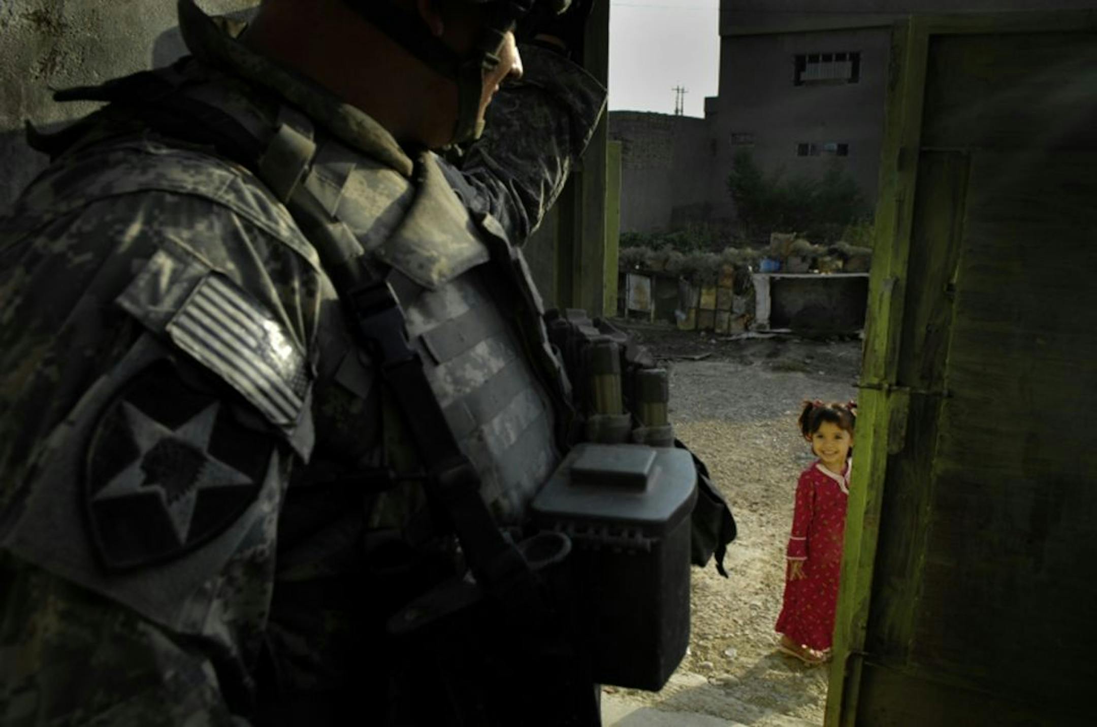 This photo of an encounter between her son Matt and an Iraqi girl reminds Kathy Cleveland that "he is doing something good" overseas.