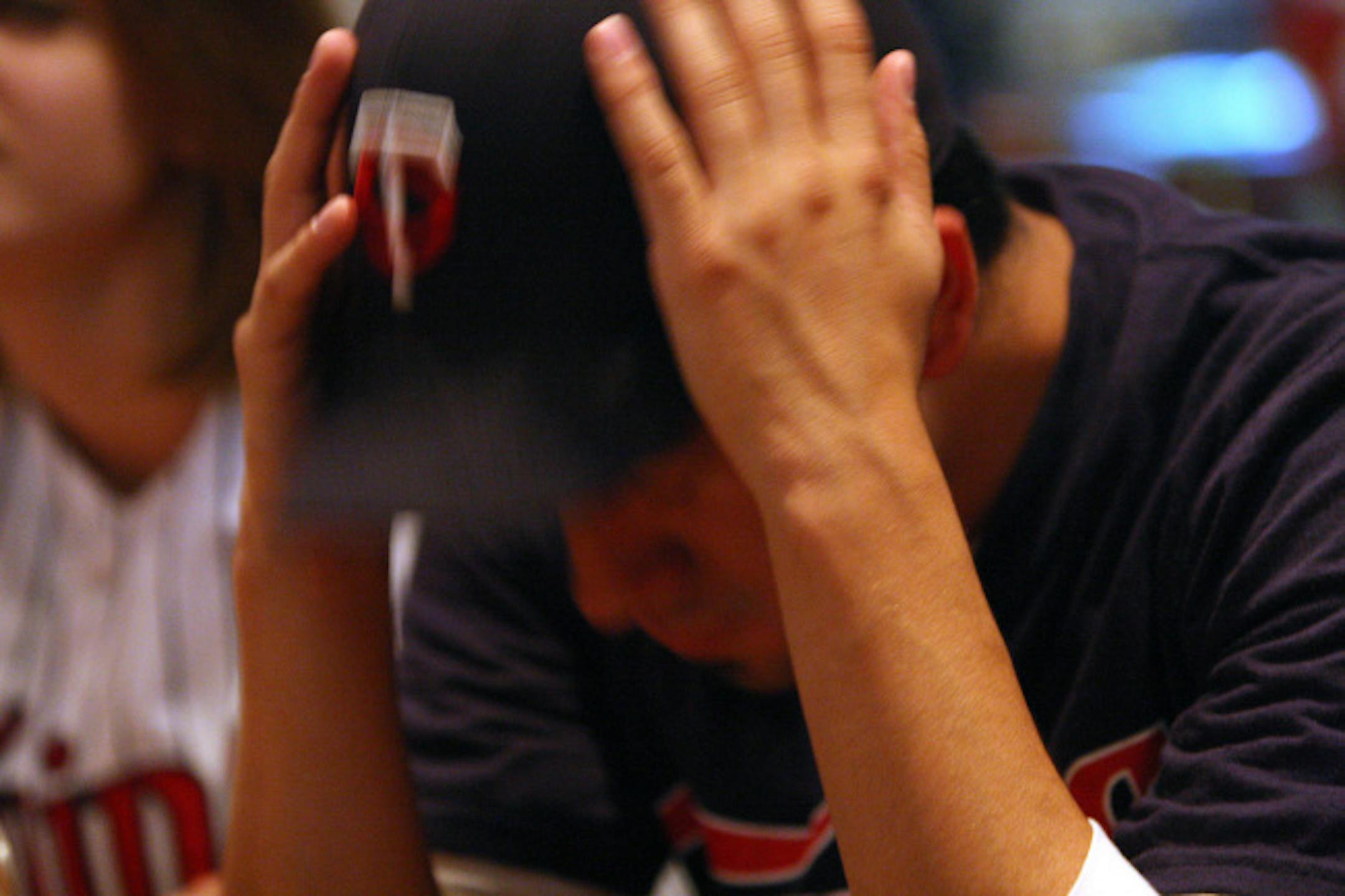 Fan Jim Olson, 23, of Minneapolis couldn't bear to watch at Majors Sports Cafe in Golden Valley. Sure the Twins lost, but their followers said they appreciated the team's season-long efforts, nonetheless. A5